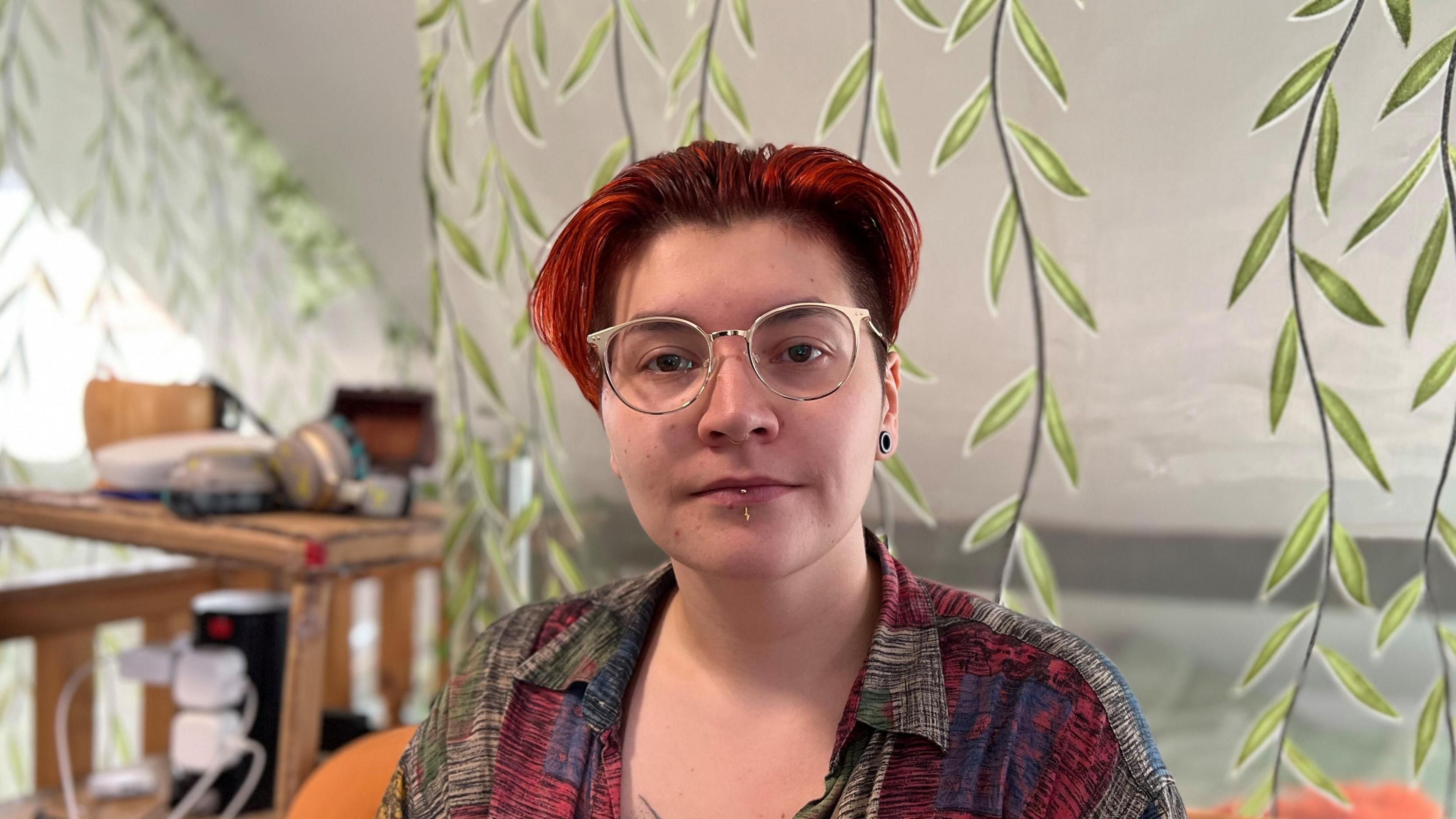 A University of Derby student, Rosie, sat in their student accommodation in Derby.