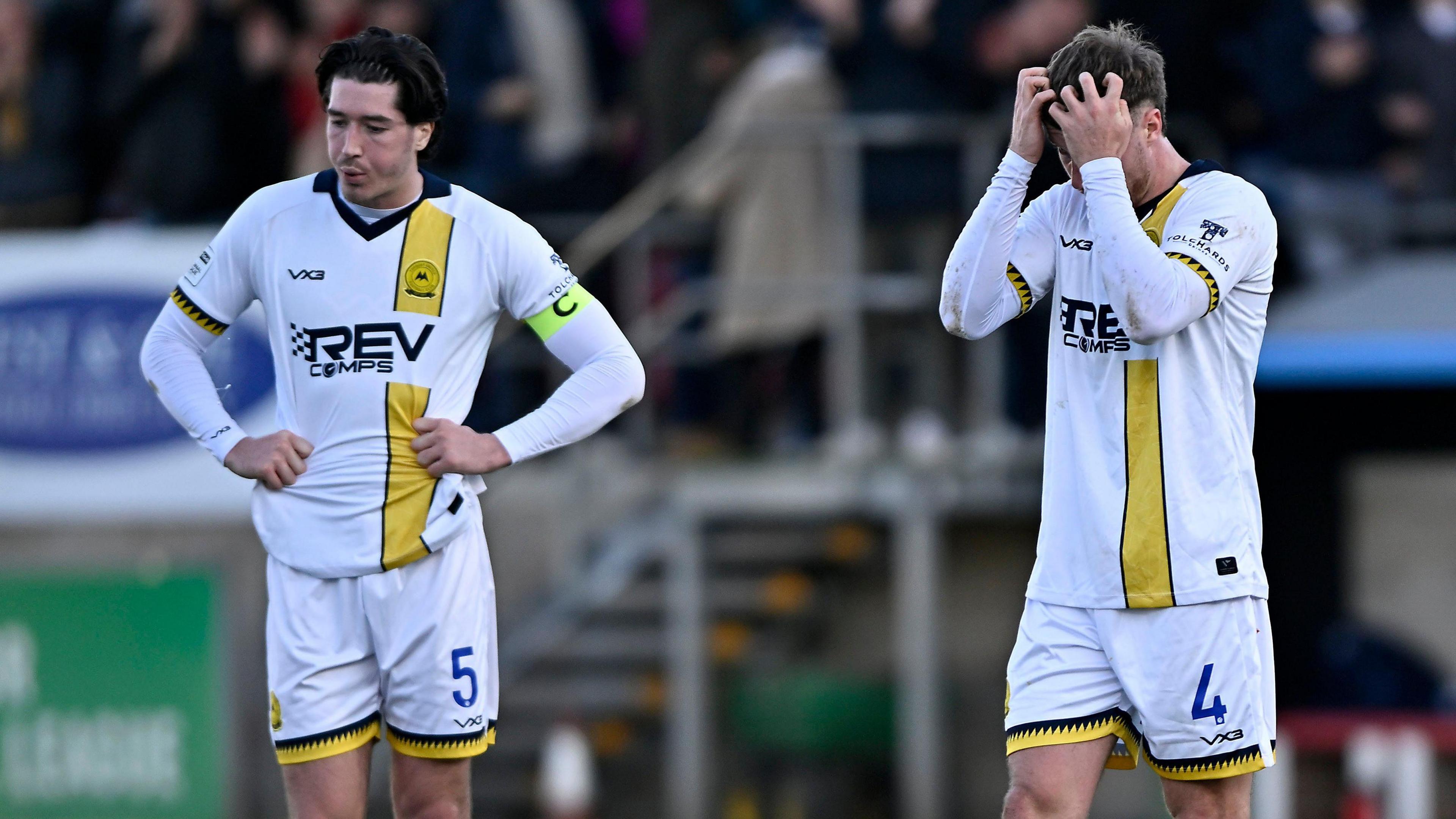 Jordan Dyer and Sam Dreyer look dejected after losing 1-0 at Dagenham and Redbridge