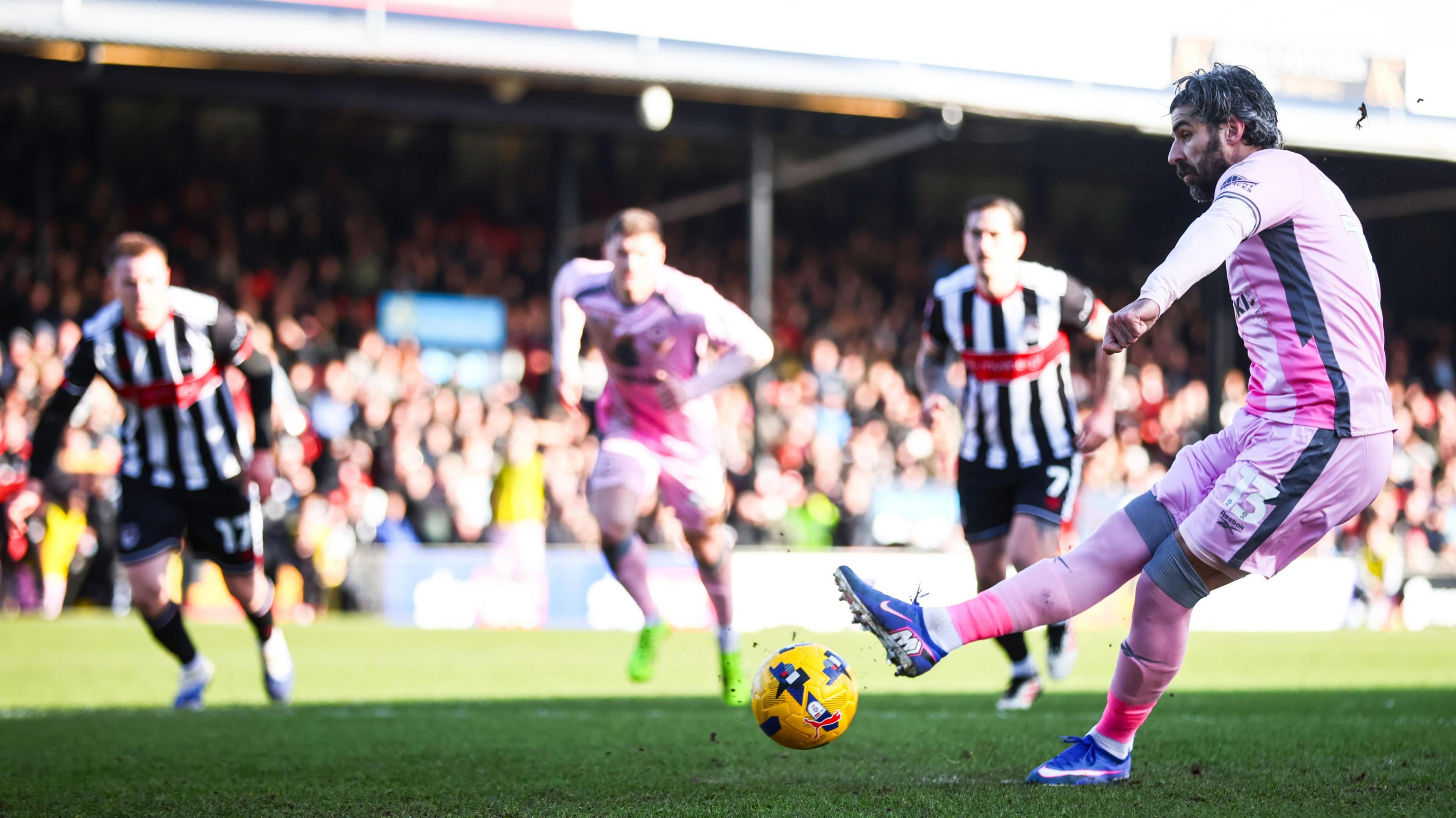Callum Paterson scores from the penalty spot against Grimsby Town