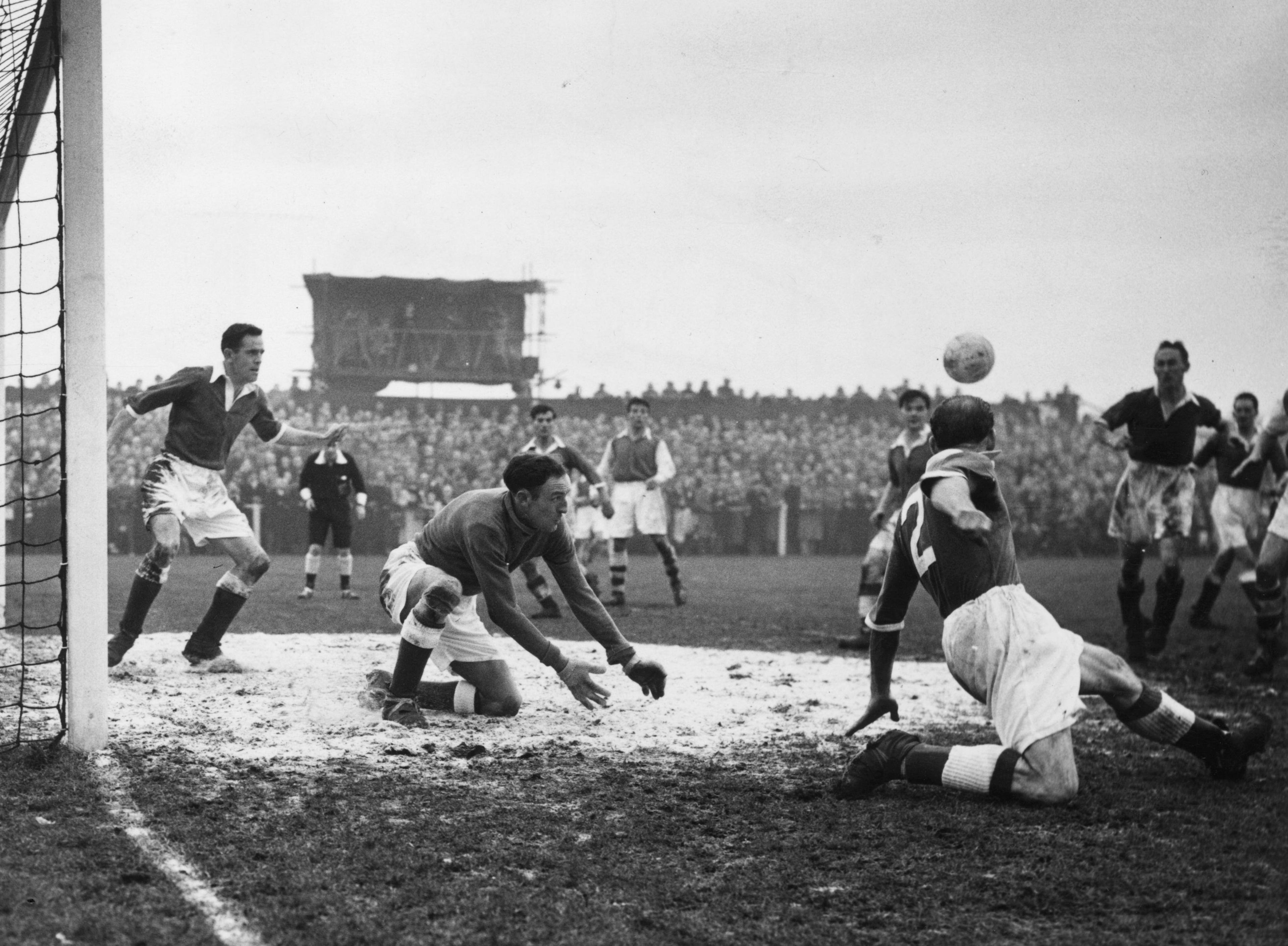 A goalmouth scramble during an FA Cup game between Bedford Town and Arsenal in 1955-56 season