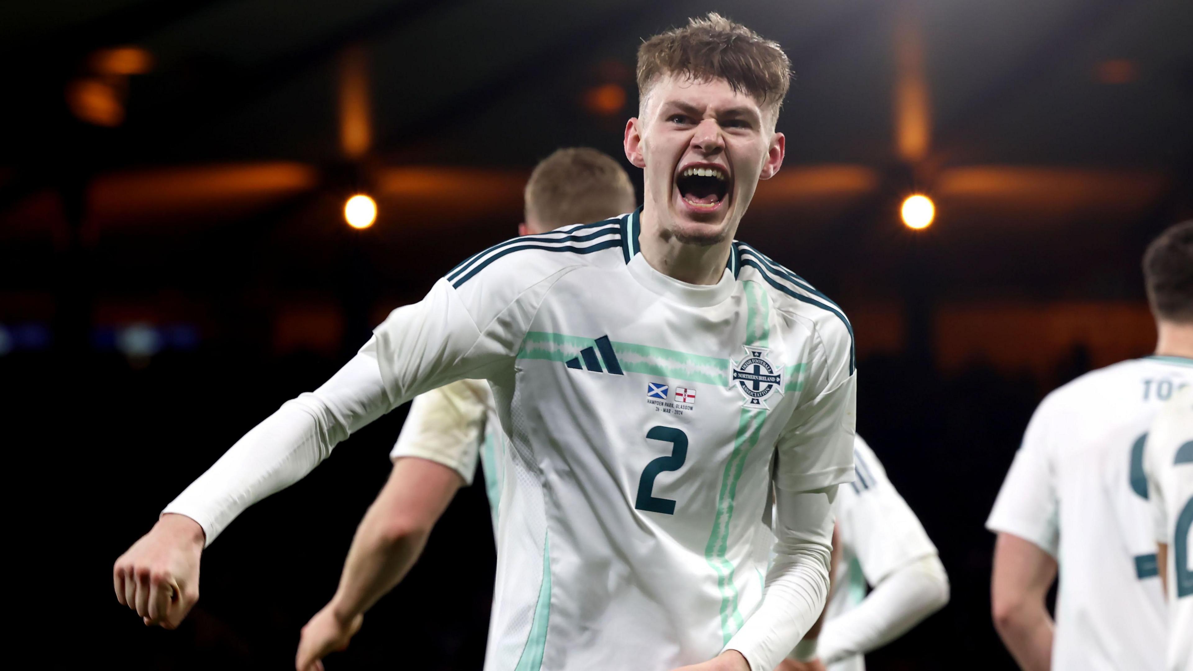 Conor Bradley celebrates a goal against Scotland