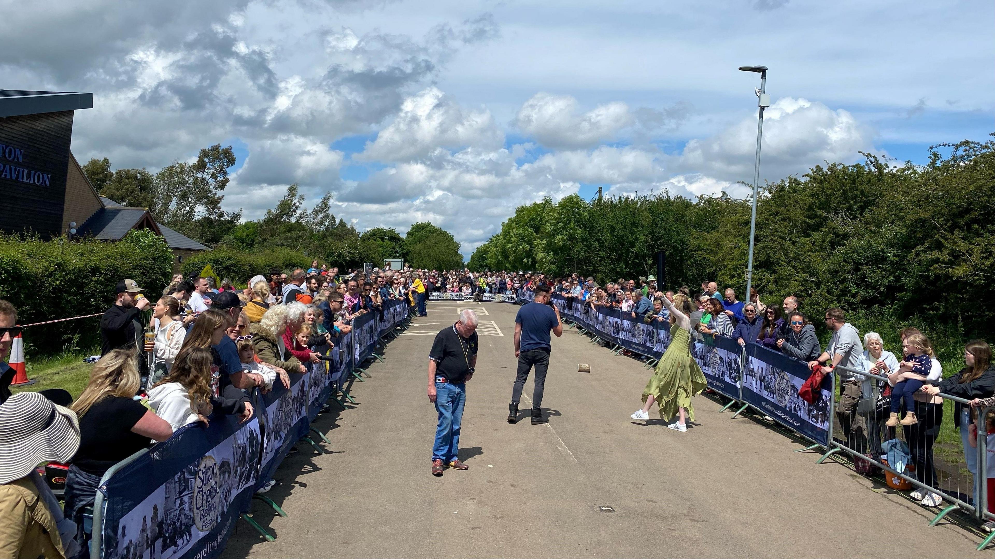 Competitors must roll the "cheese" along a course at Stilton Pavilion