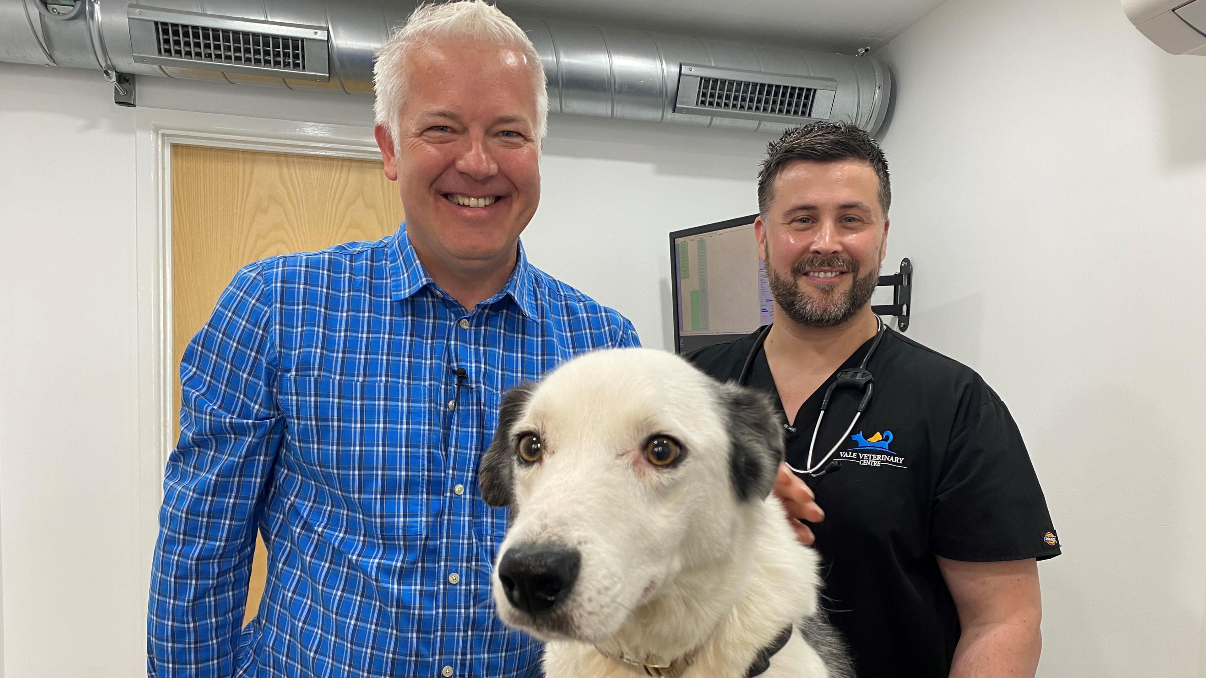 Derek and vet Richard Williams and Shadz the dog 