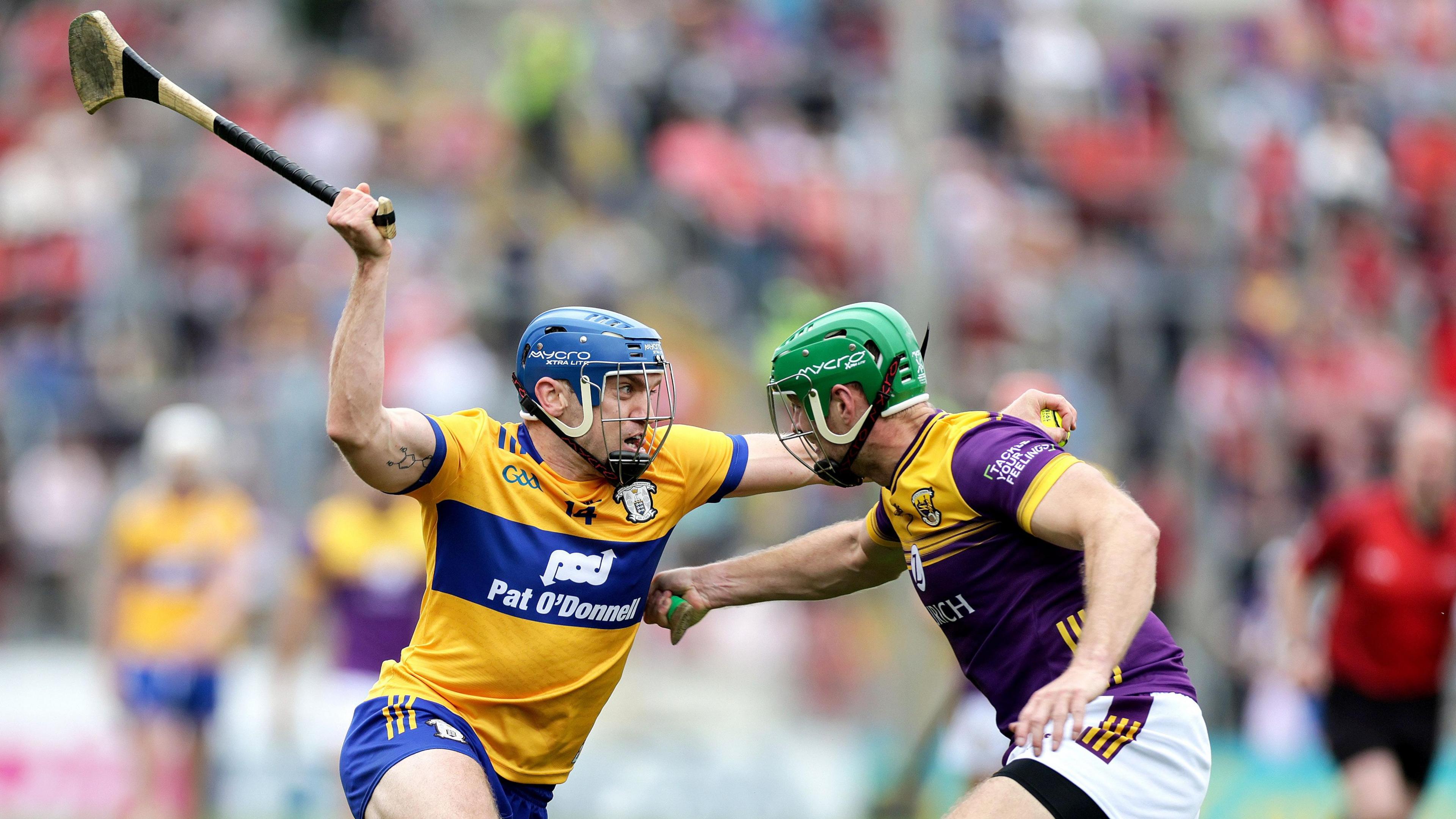 Clare's Shane O'Donnell attempts to get past Wexford's Matthew O'Hanlon at Semple Stadium