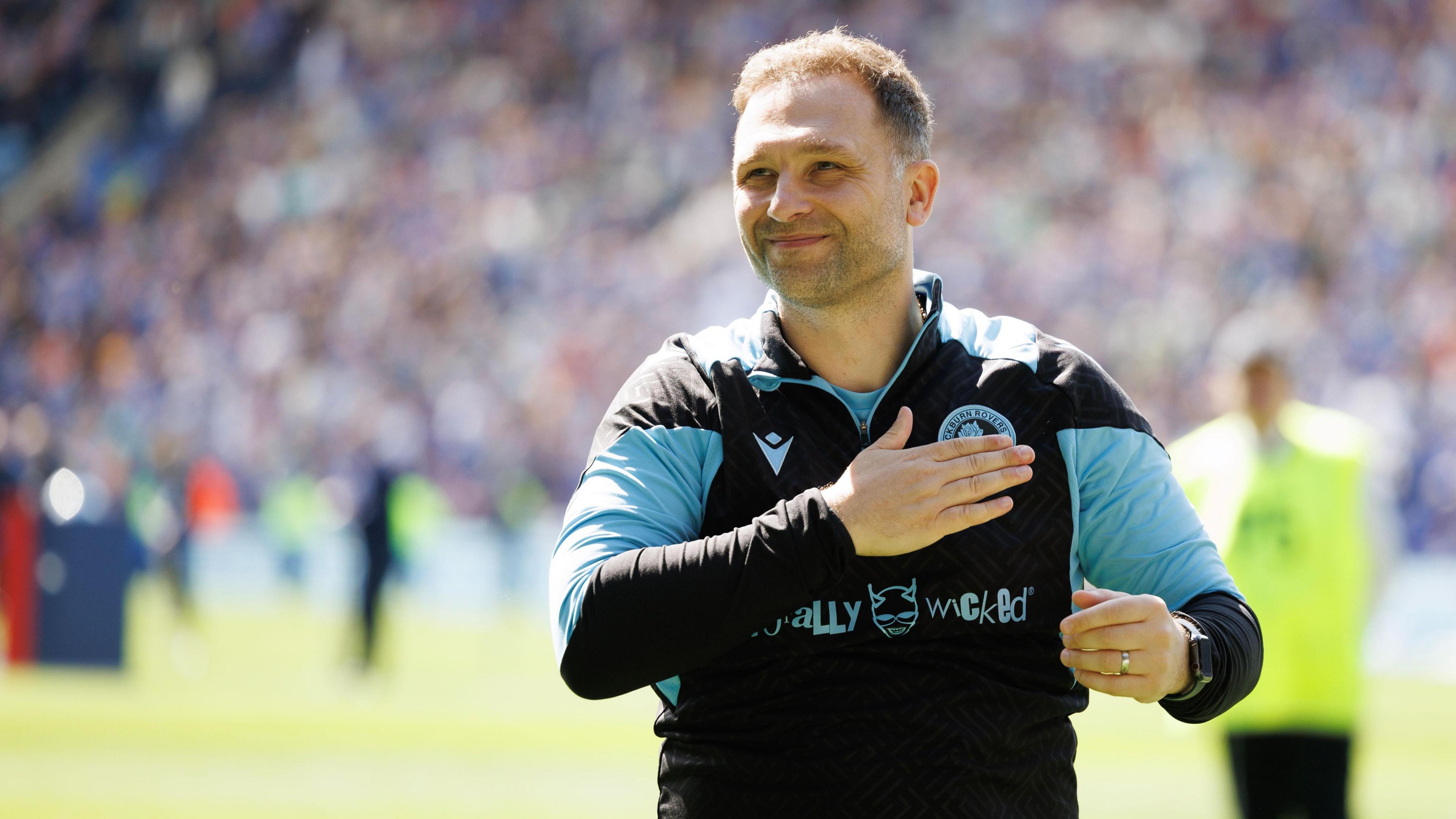 John Eustace celebrates with the Blackburn fans after winning at Leicester City