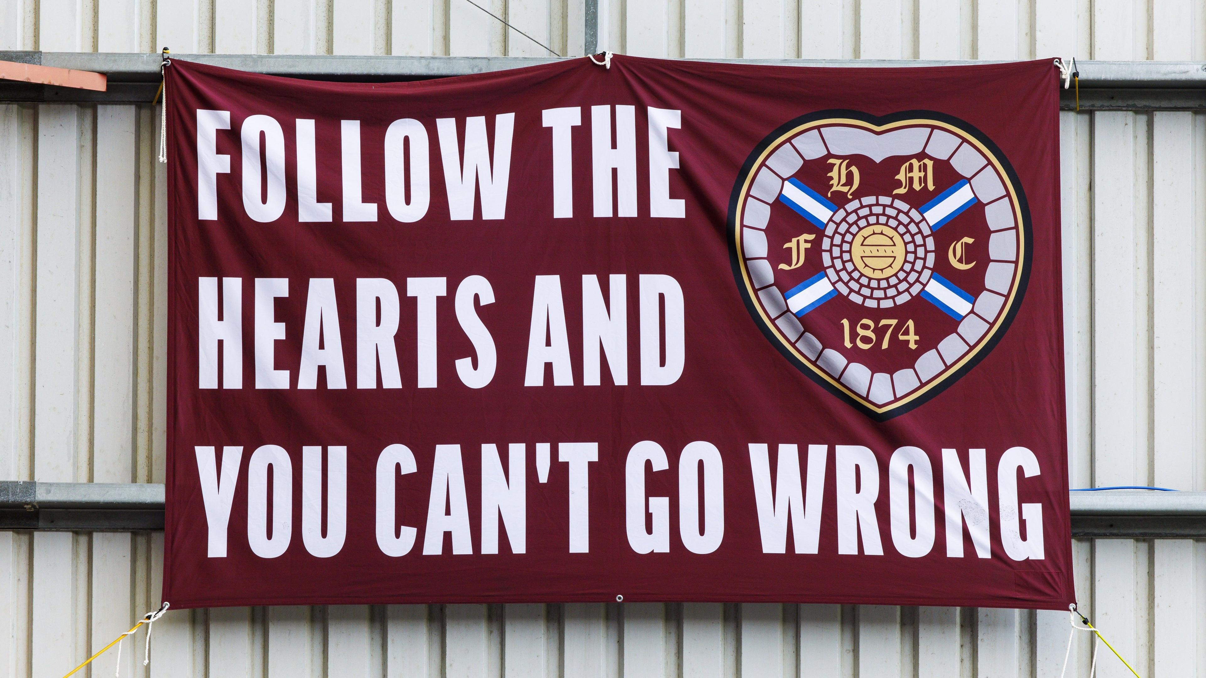 A Hearts flag draped at a managerless Tynecastle