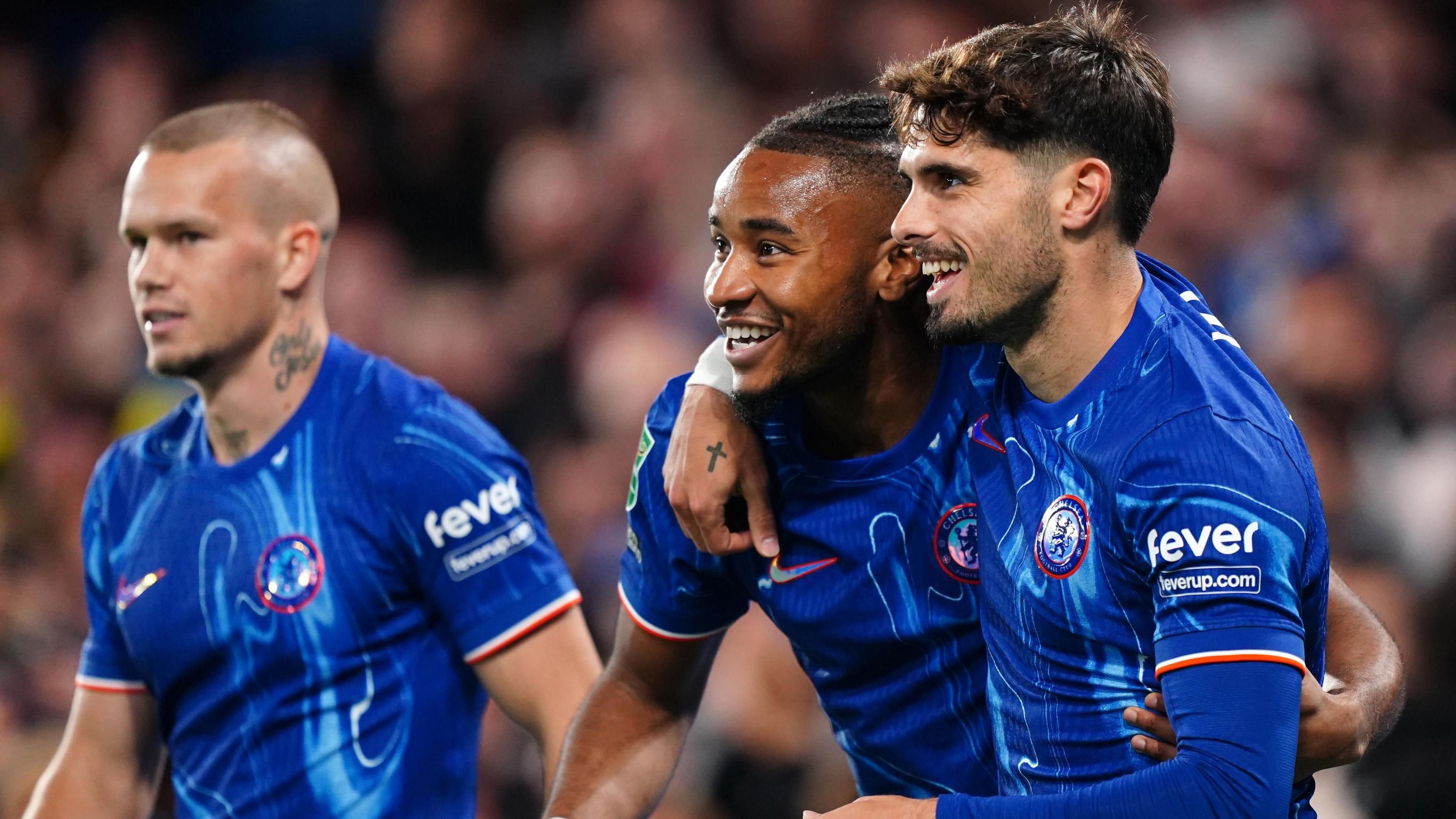 Christopher Nkunku celebrates with Pedro Neto.