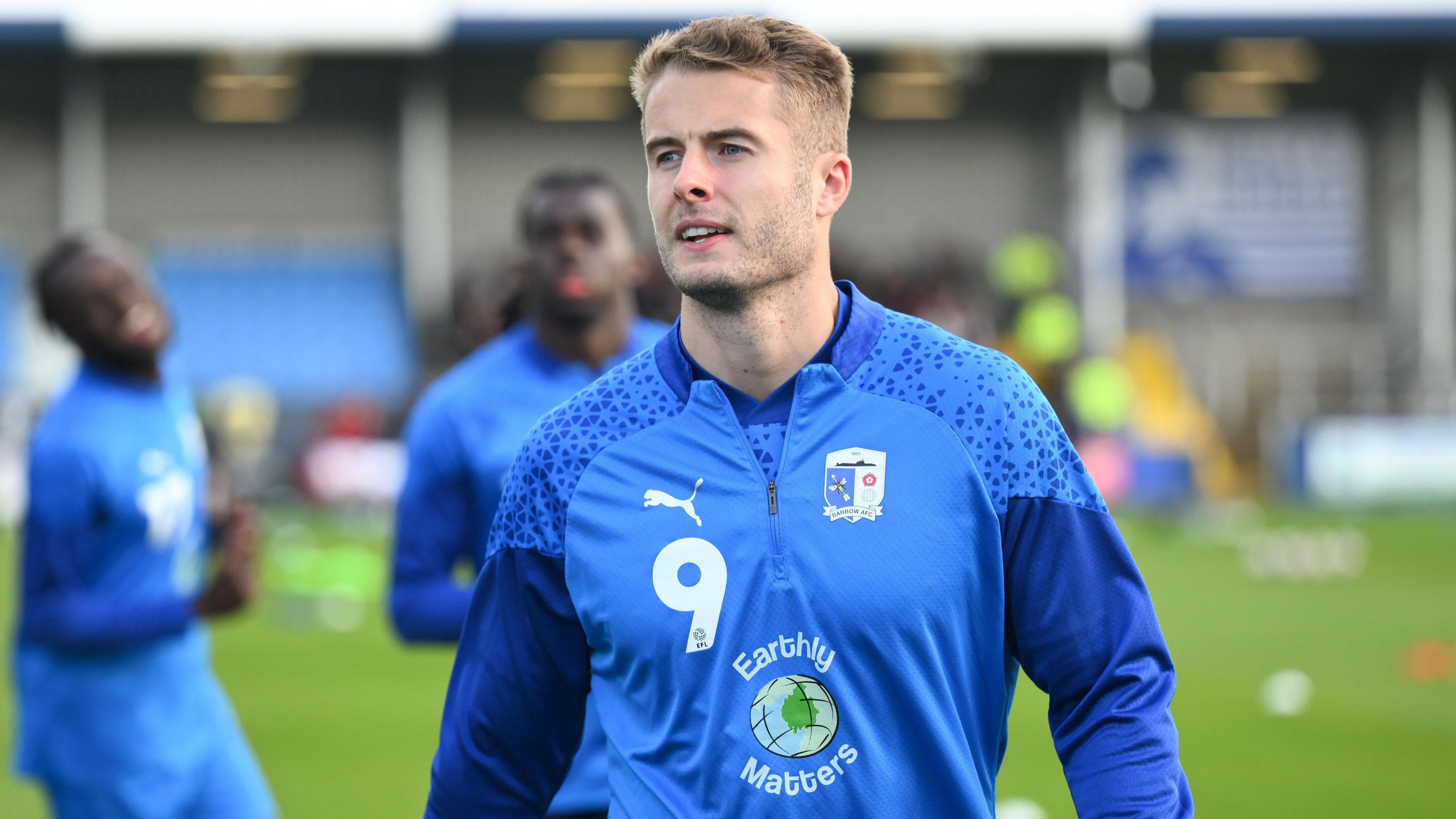 Andrew Dallas during a pre-match warm-up 