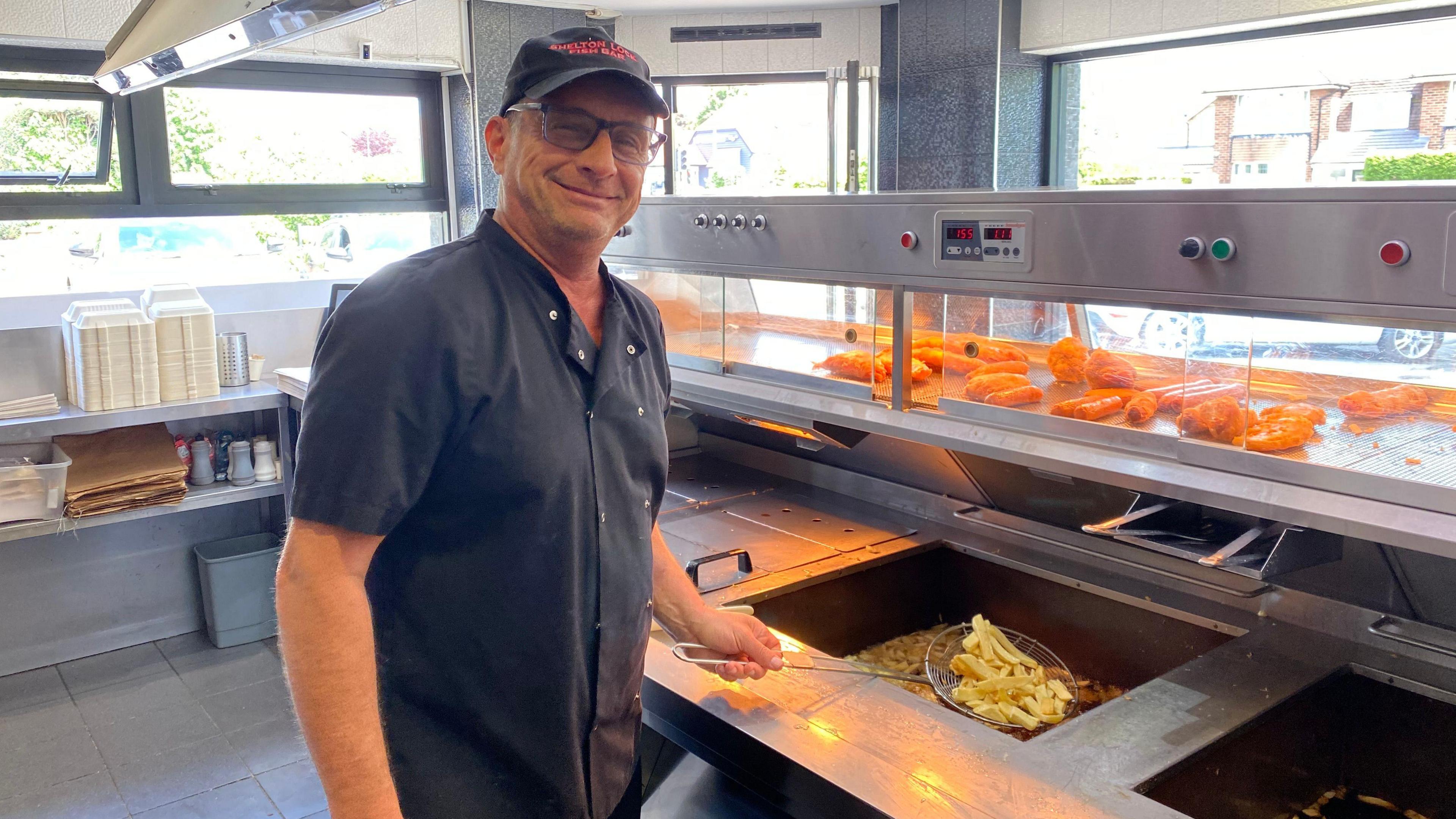 Andreas Symeou frying chips at Shelton Lock Fish Bar