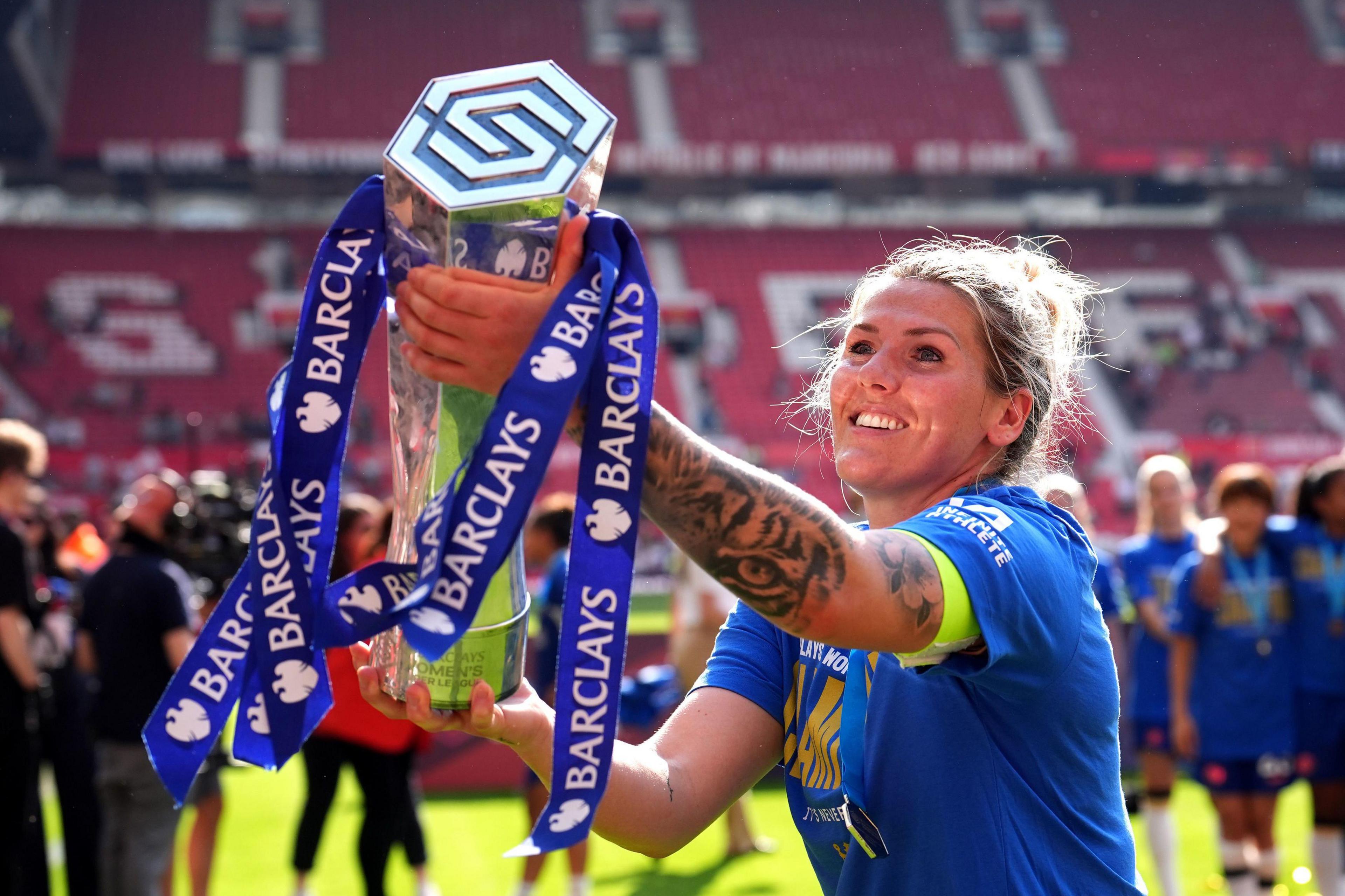 Chelsea's Millie Bright celebrates with the trophy after winning the Barclays Women's Super League match at Old Trafford, Manchester, 18 May 2024