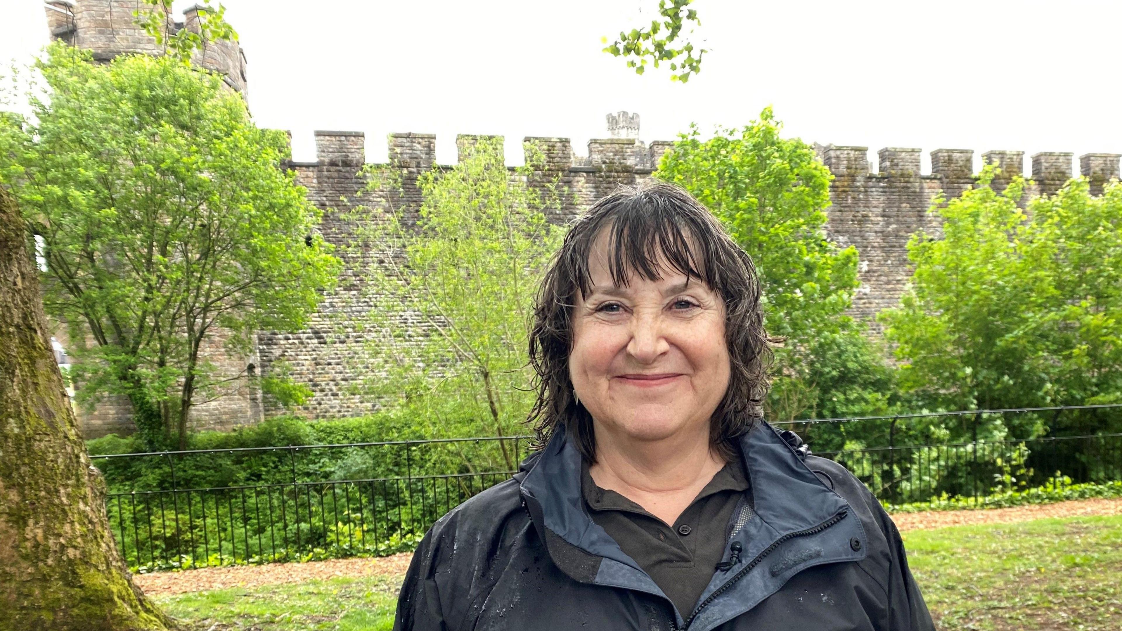 Karen Clarke of Natural Resources Wales standing smiling in a park