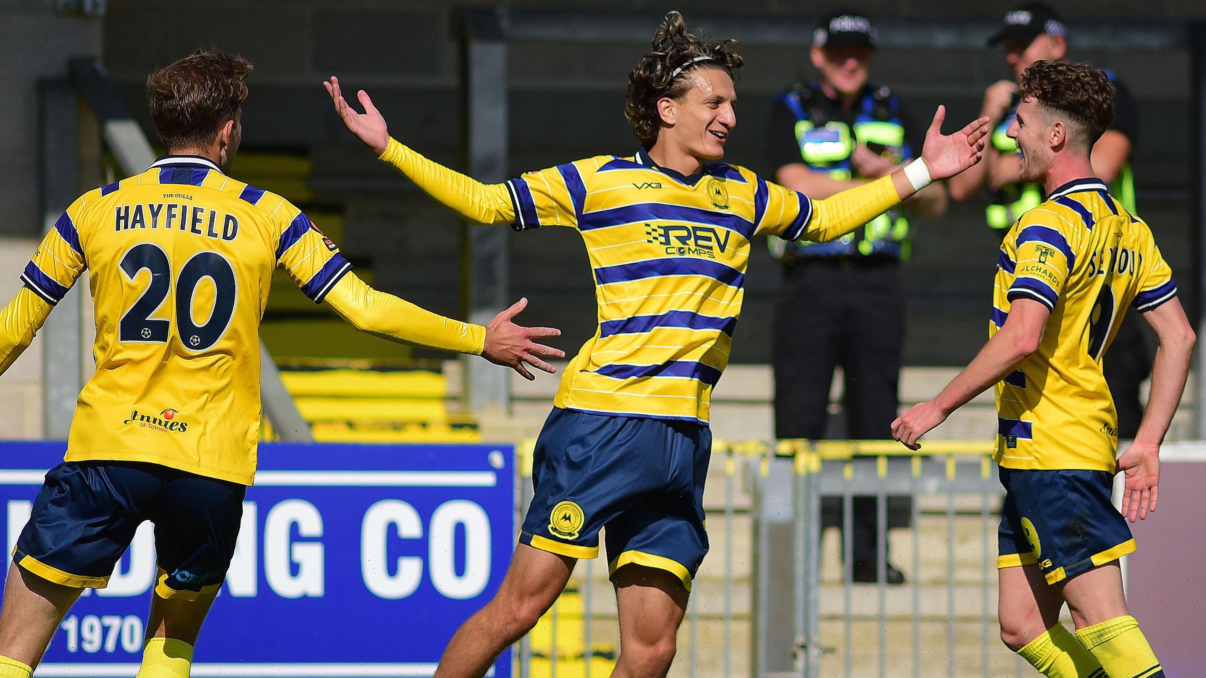 Lyrak Hasani celebrates scoring for Torquay