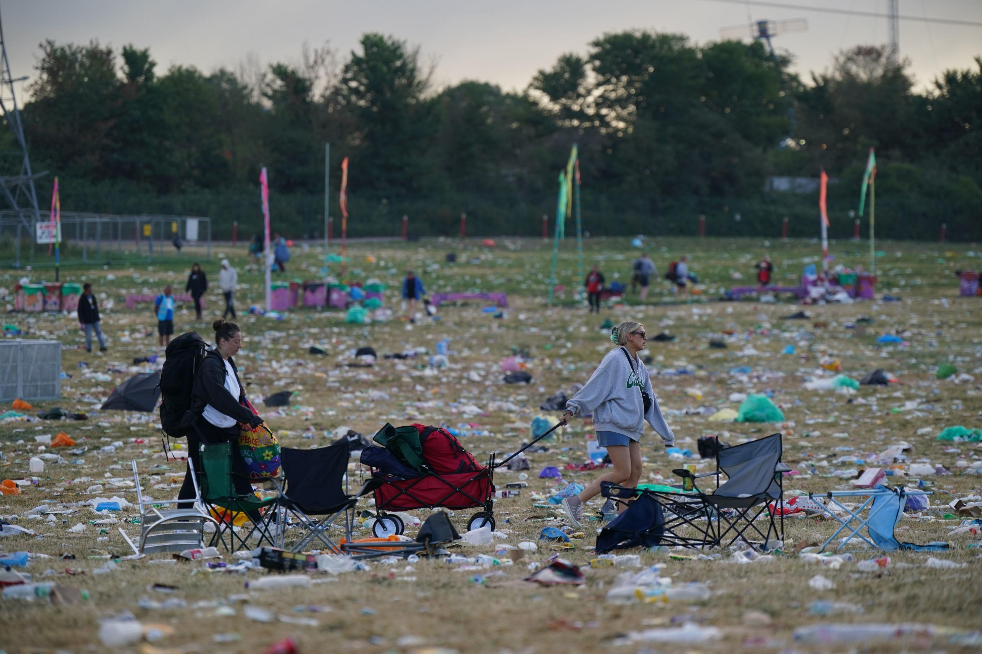 People seen leaving the Glastonbury Festival at Worthy Farm in Somerset. 