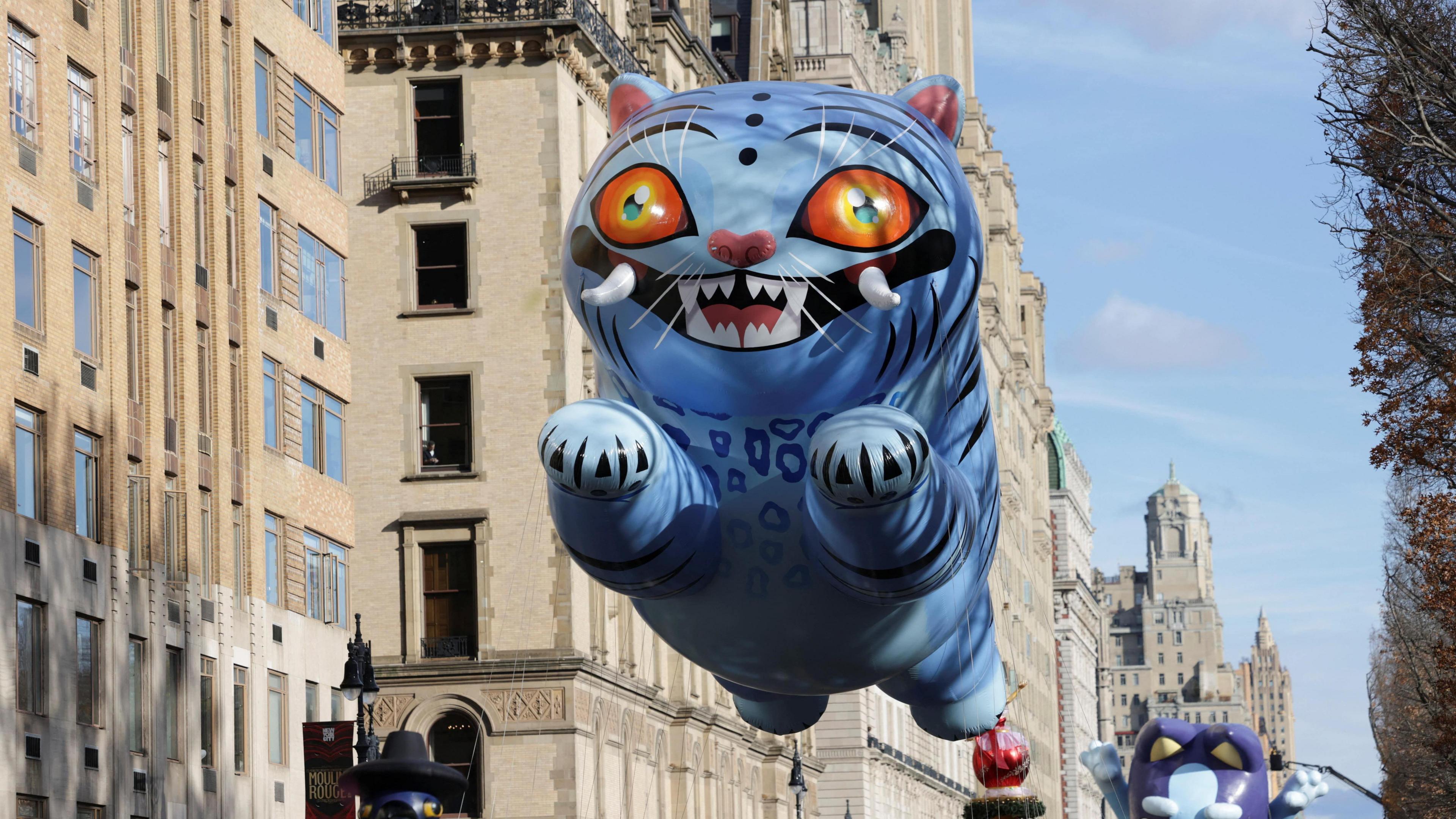 Derpy tiger balloon floats down the streets of New York.