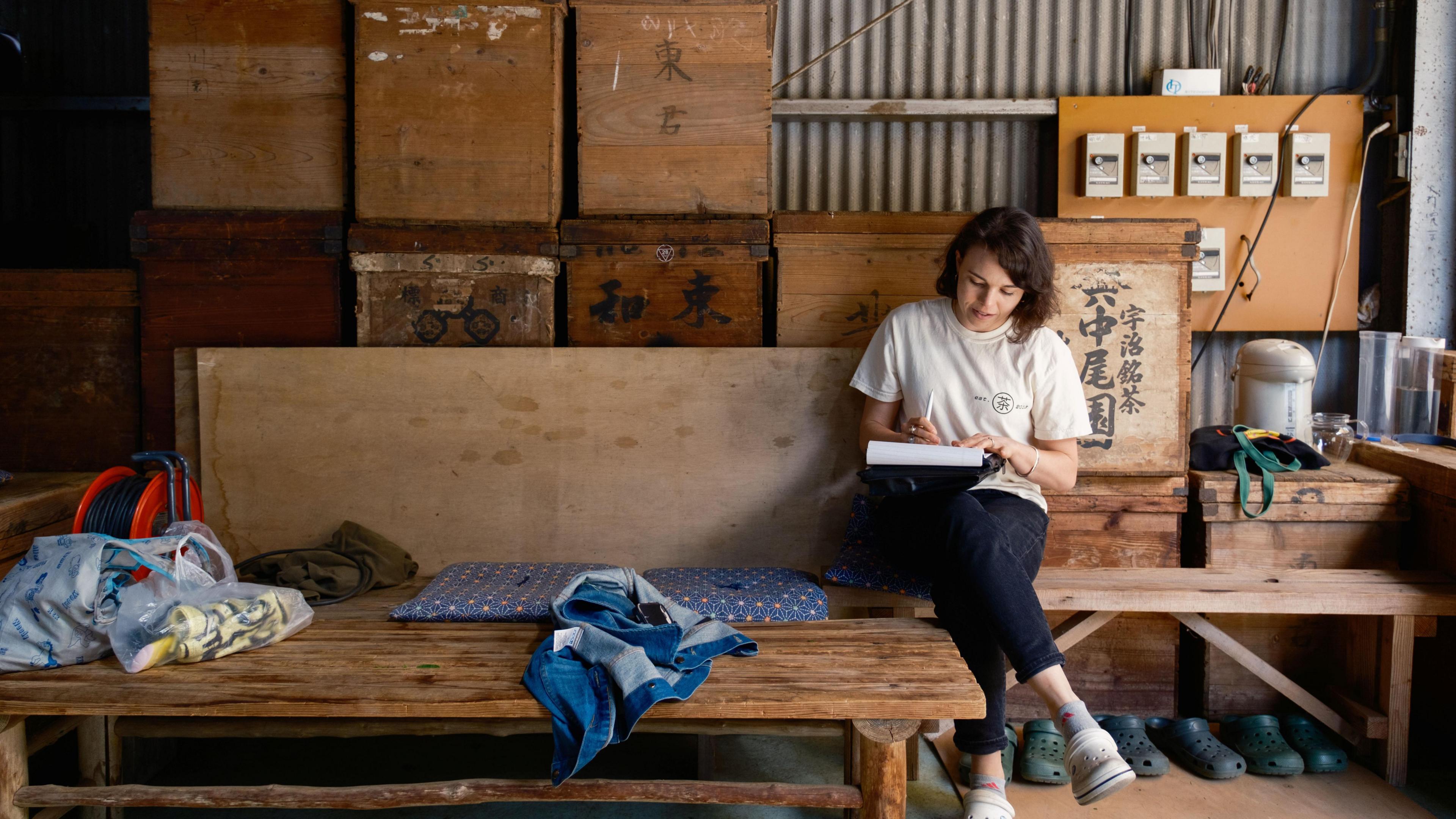Lauren Purvis of Mizuba Tea Co works on paperwork at a sencha factory in Japan