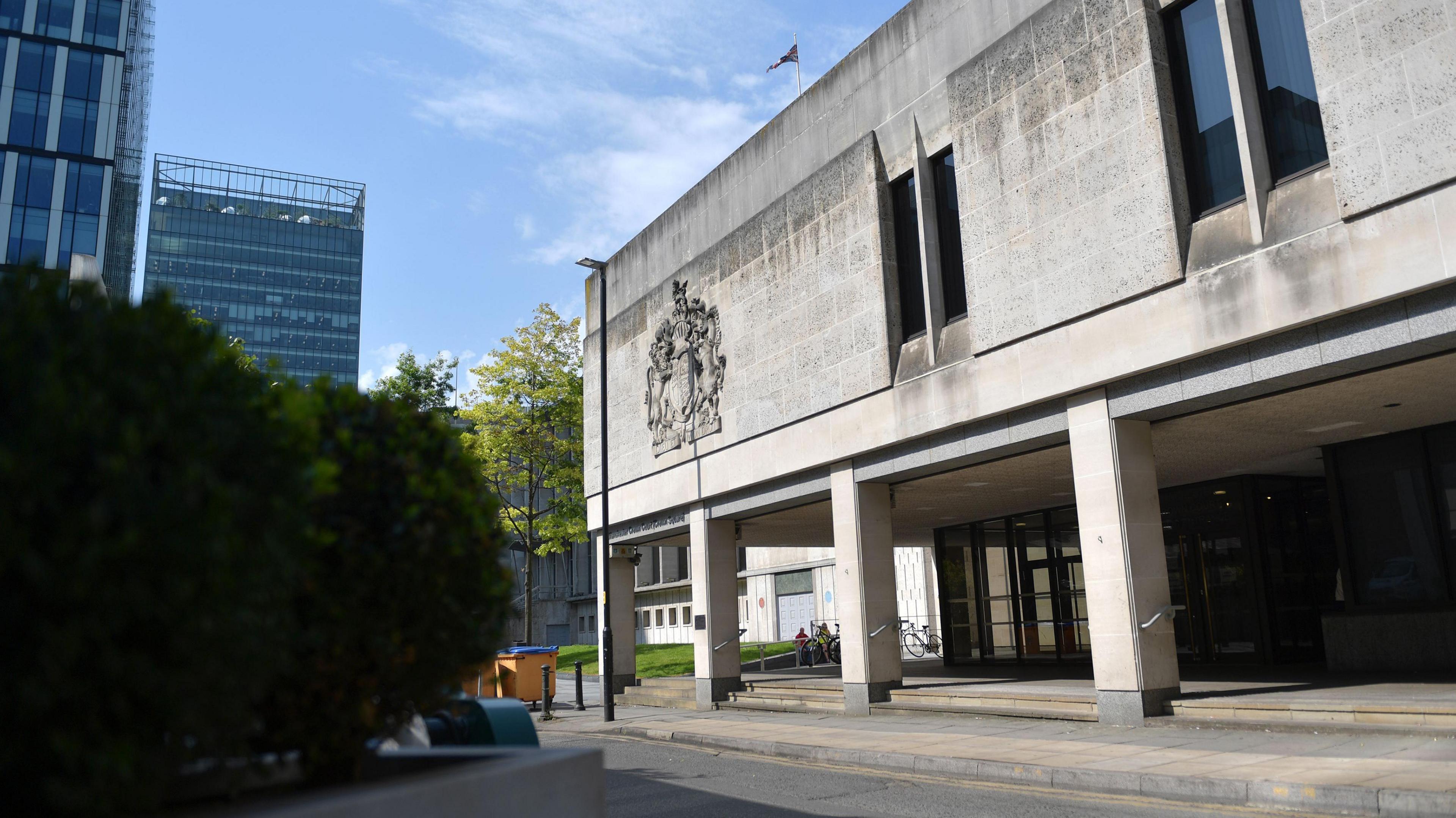 Outside view of the Manchester Crown Court building on a sunny day