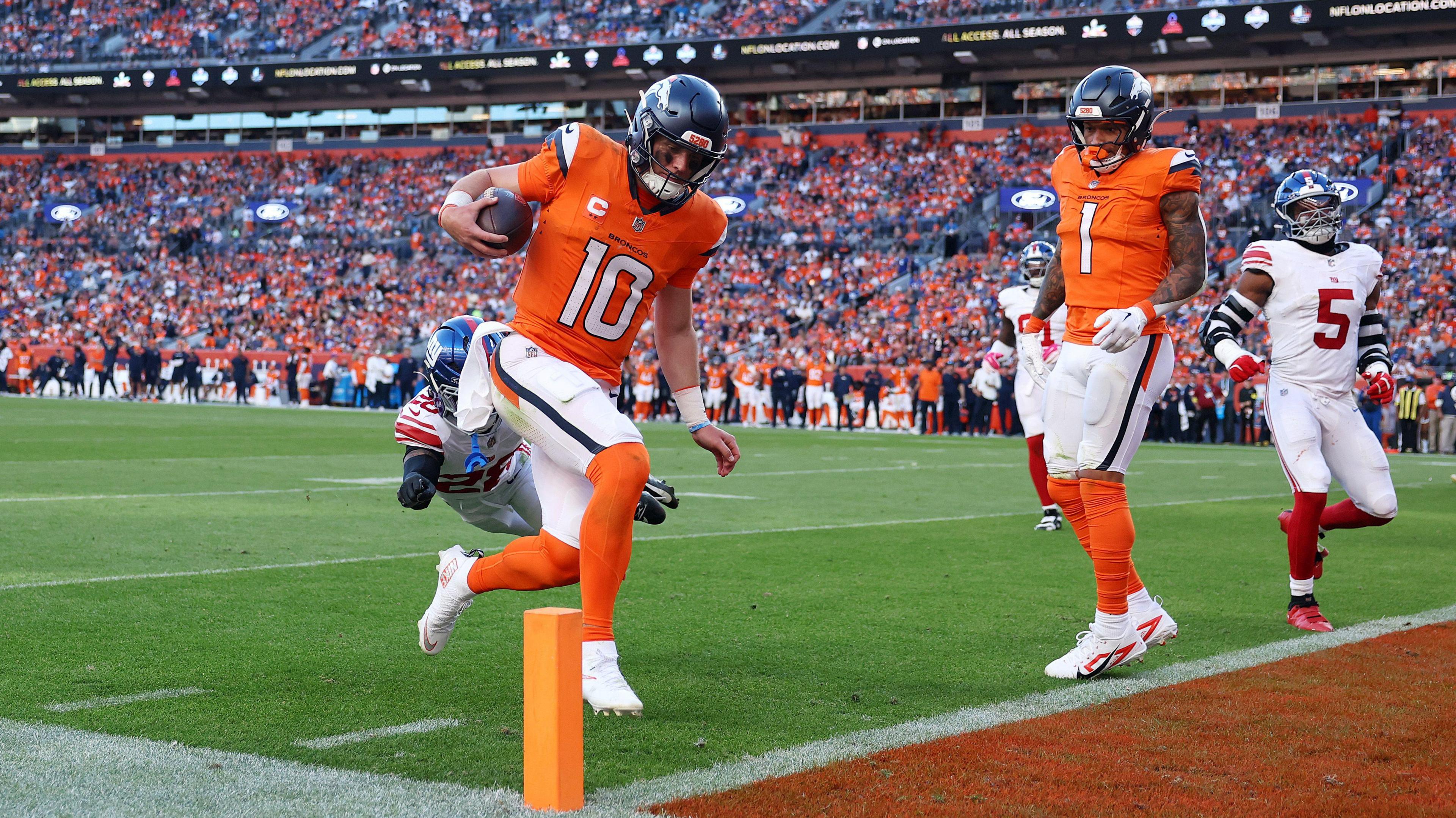 Bo Nix of the Denver Broncos scores a touchdown