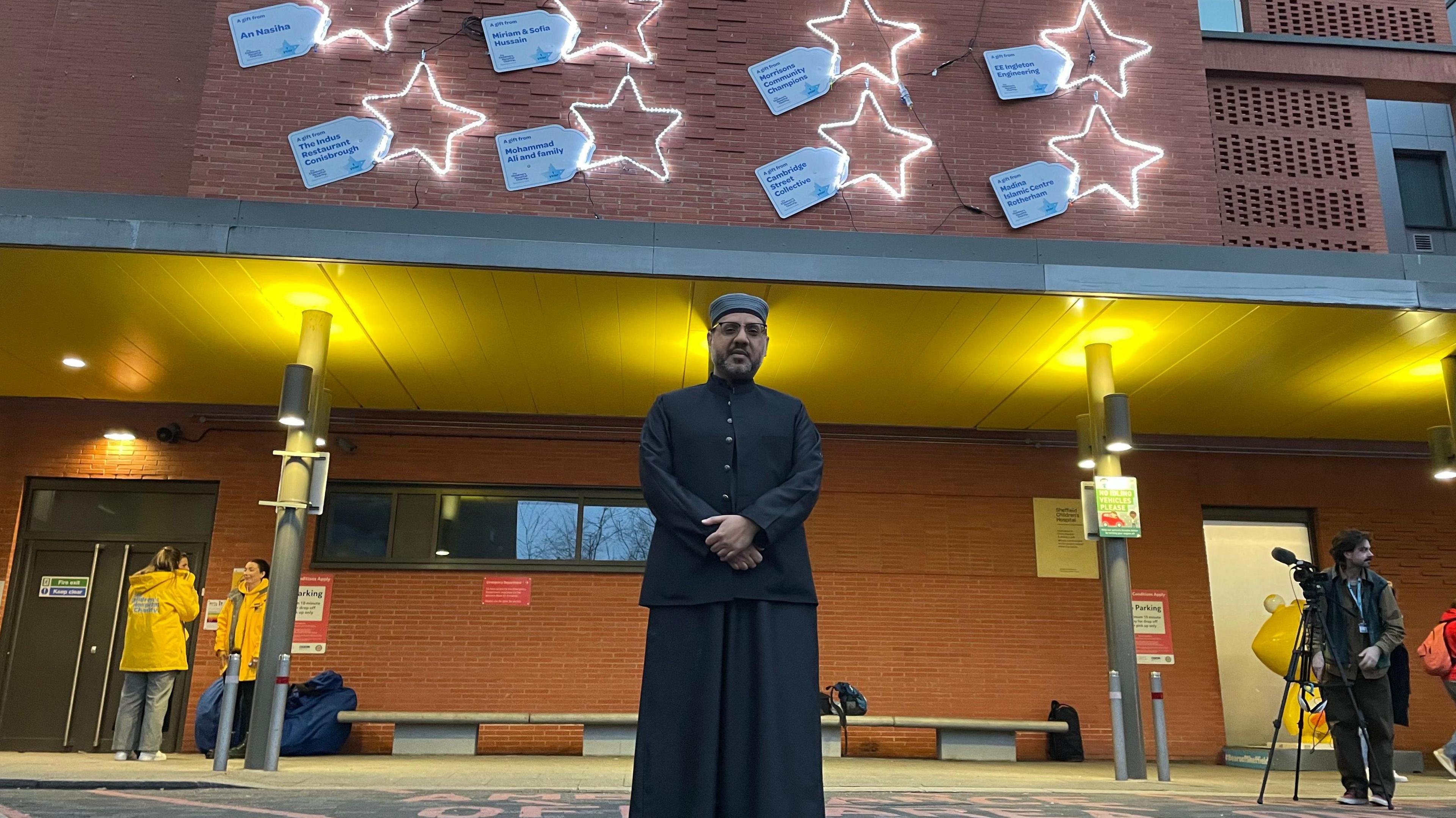 Haroon stood underneath the display of stars.