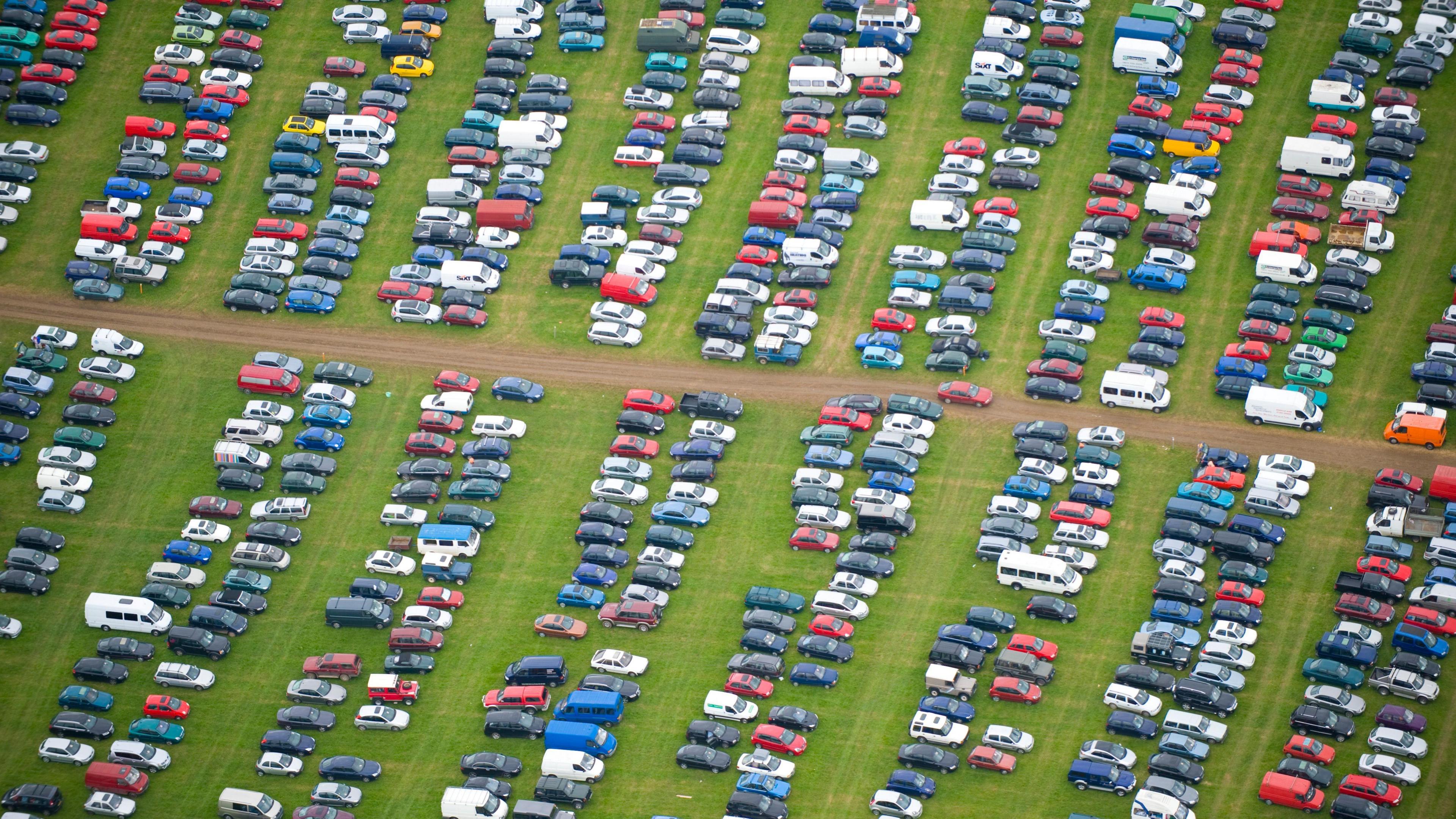 Image of cars parked in a field at Glastonbury