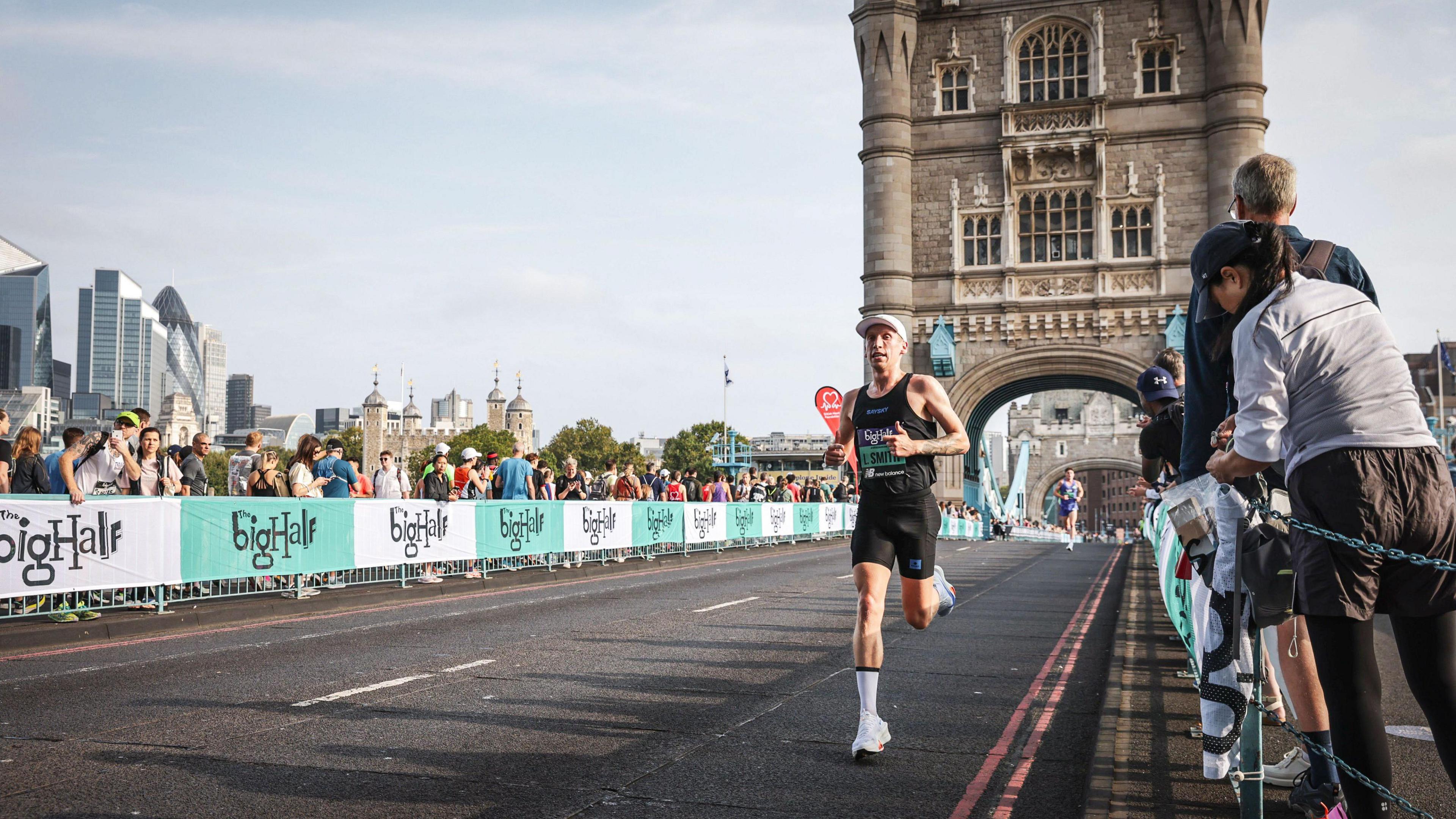 Logan Smith running over Tower Bridge in London.