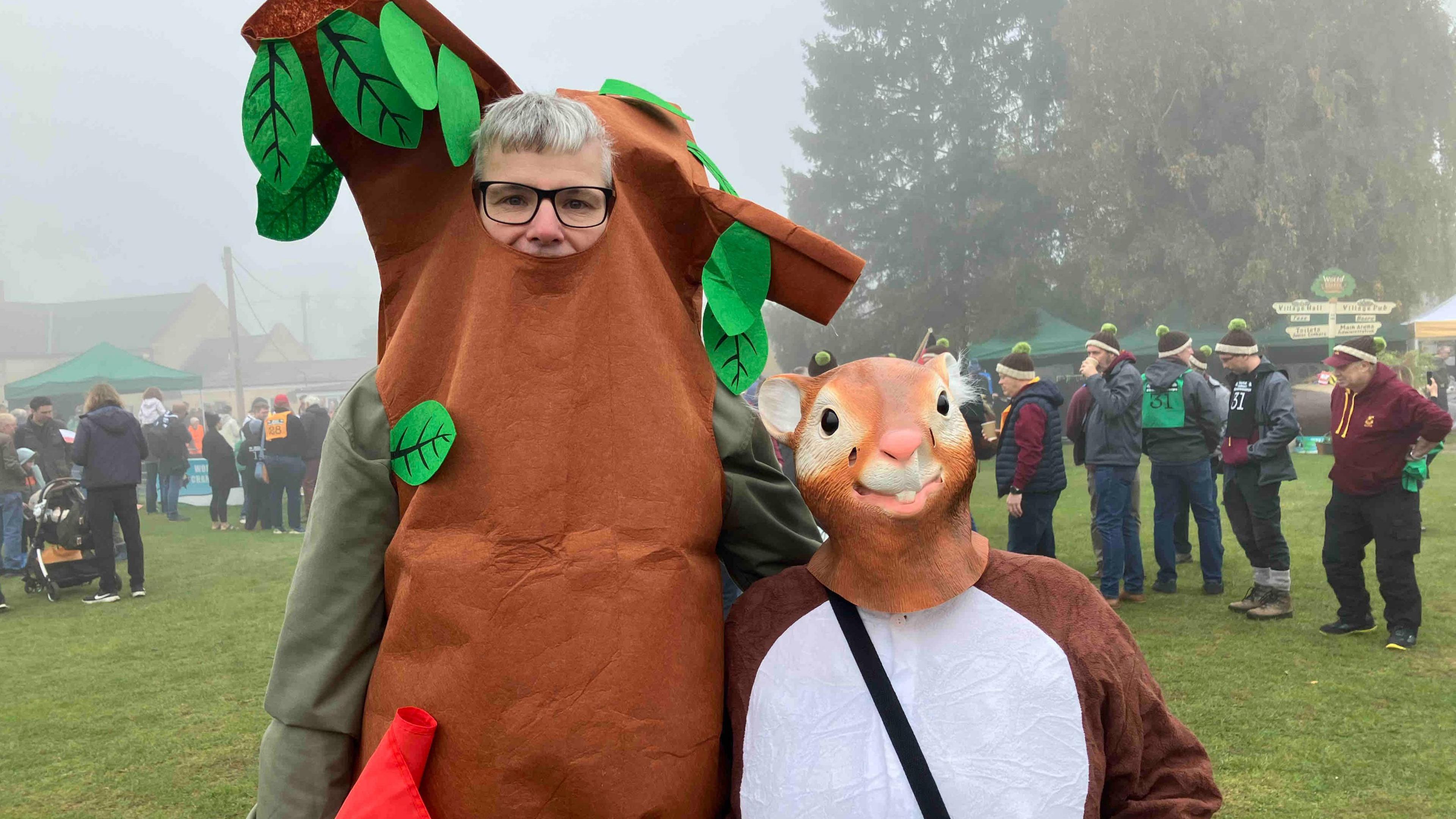 Couple dressed as tree and squirrel.