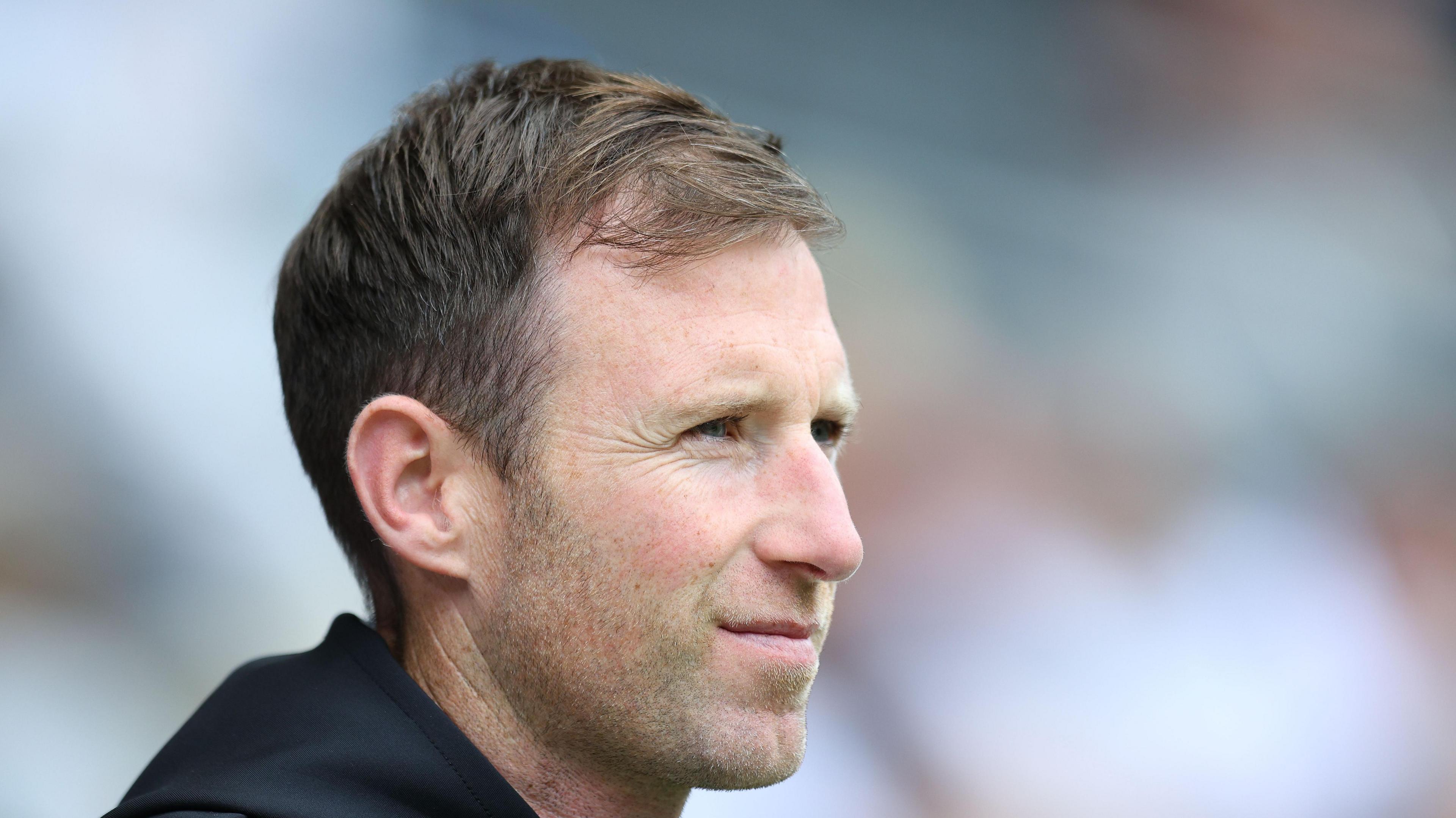 Carlisle head coach Mike Williamson stood on the touchline