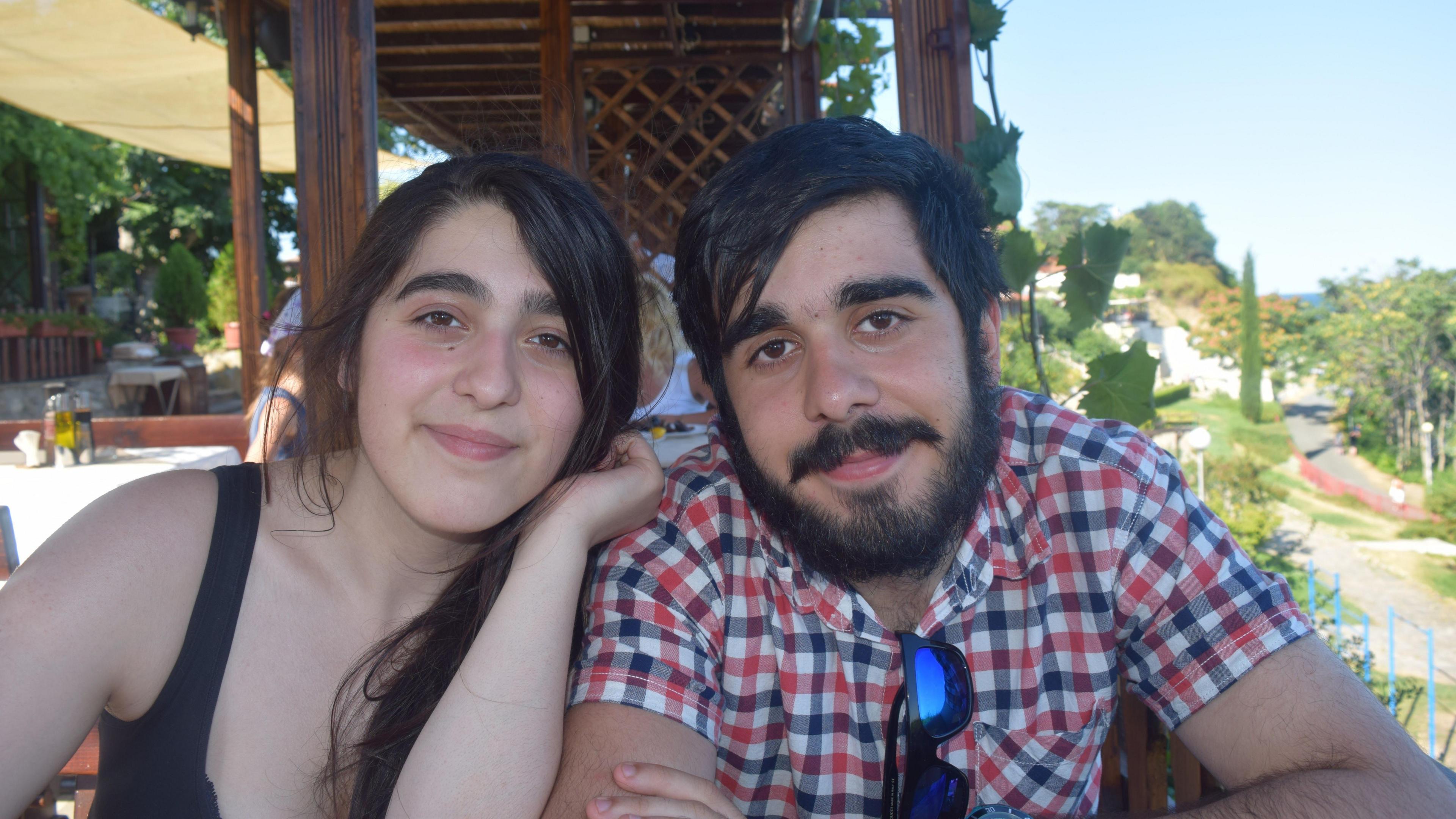 James and his sister Amy sitting outside