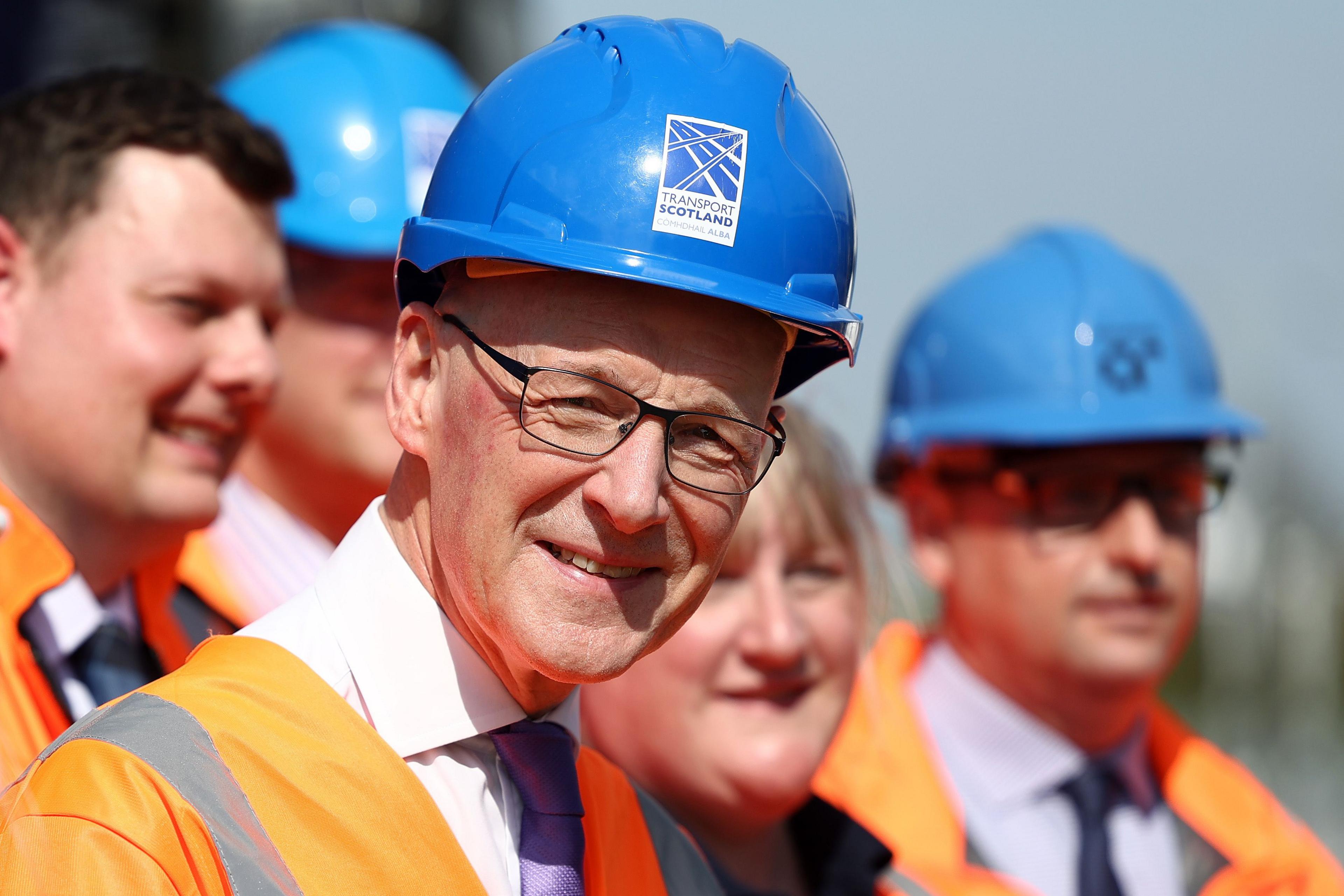 John Swinney in a hard hat