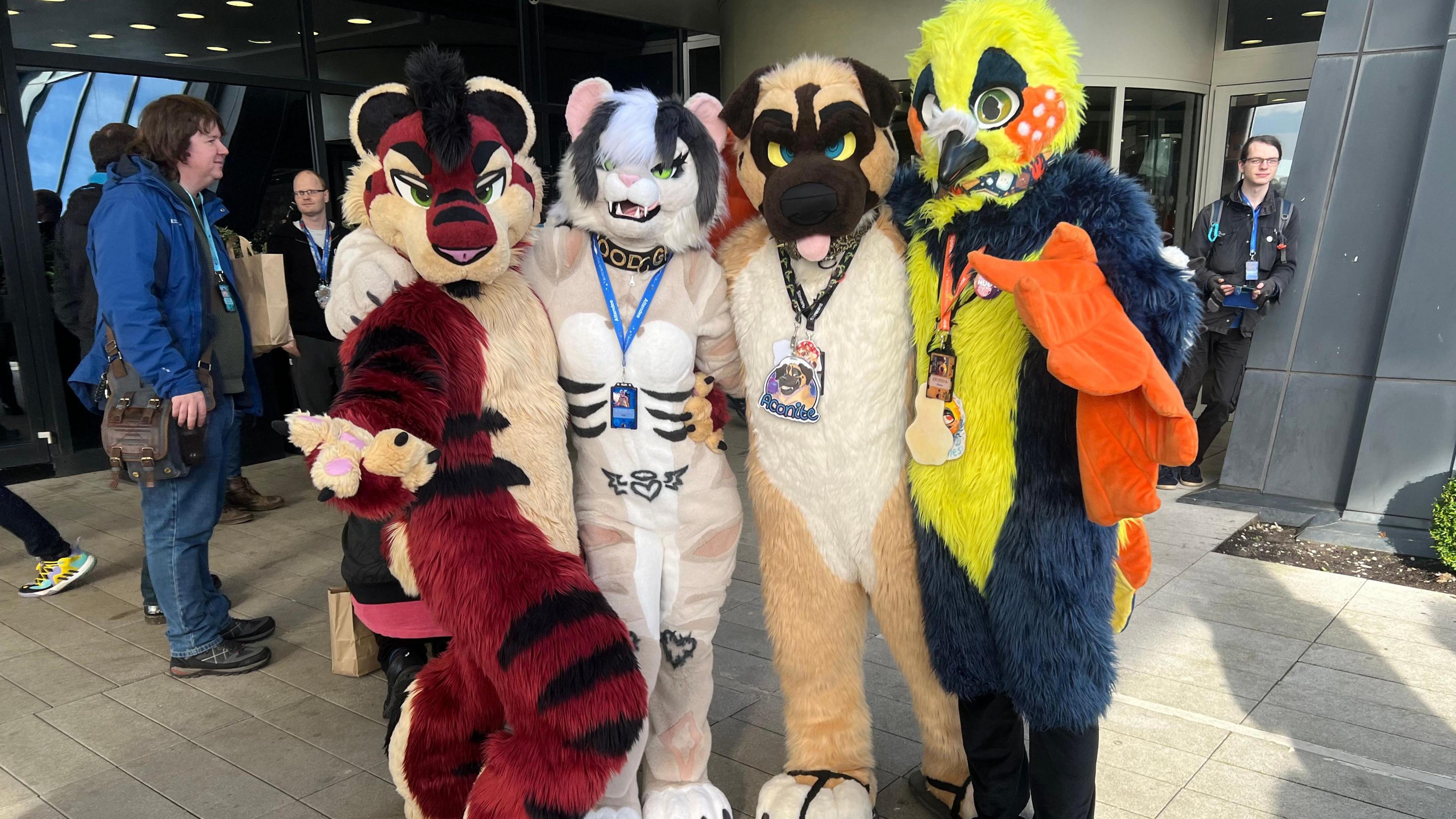 A group of furries posing for the camera 