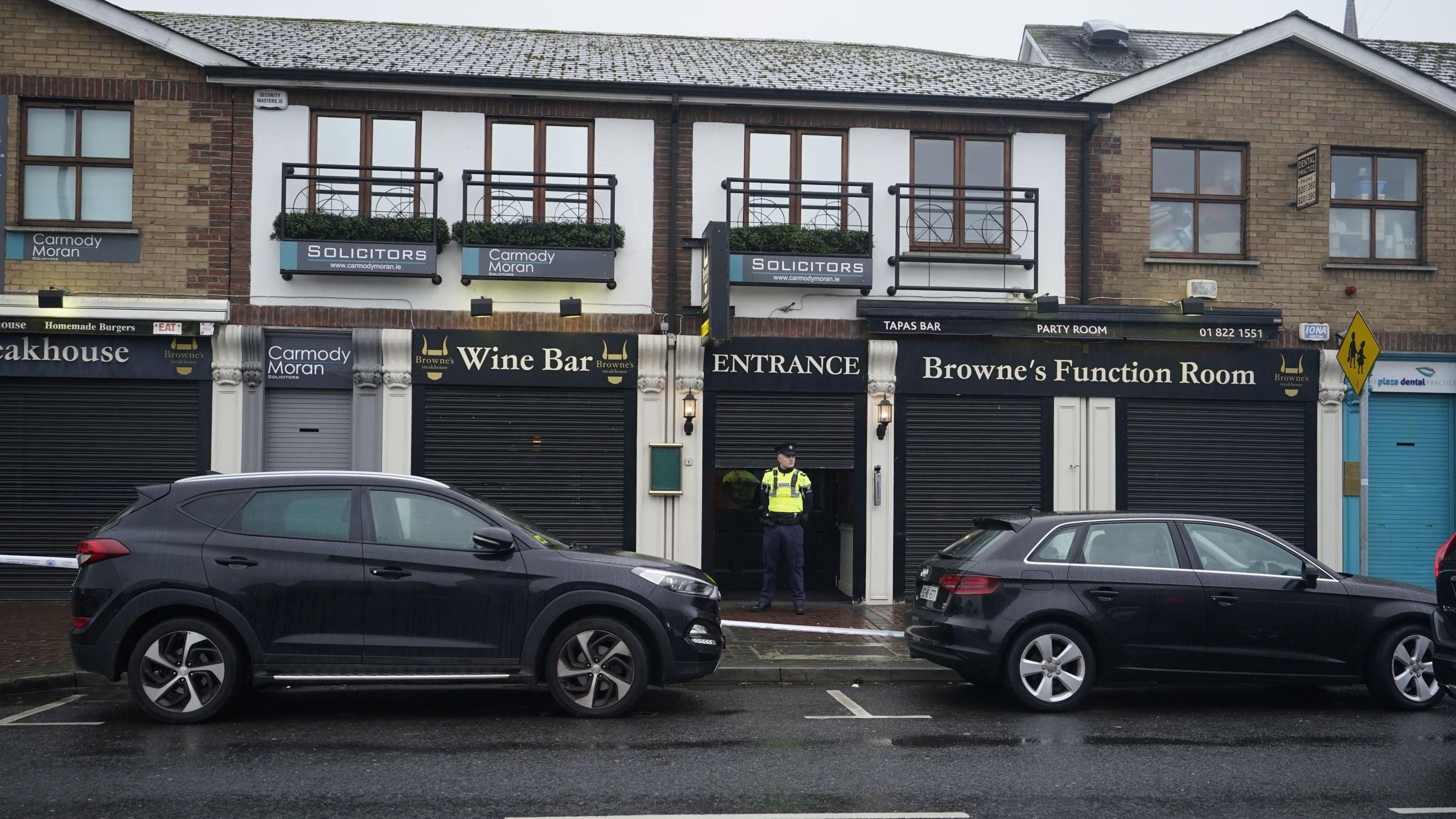 Garda officers at the scene in Blanchardstown, Dublin, where a man aged in his 20s was pronounced dead after being injured during a shooting incident at Browne's Steakhouse restaurant on Christmas Eve.