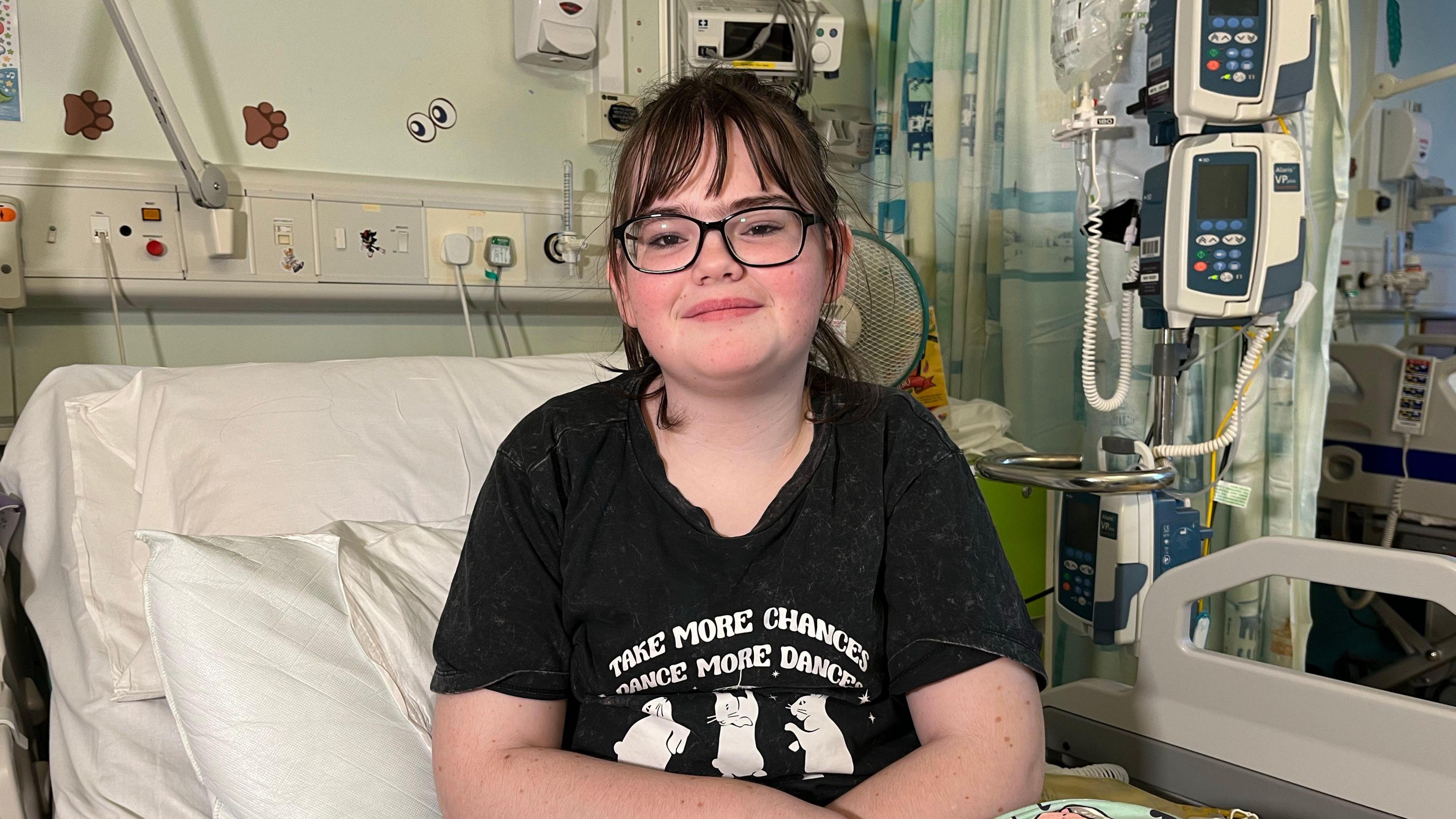 April sitting in a hospital bed