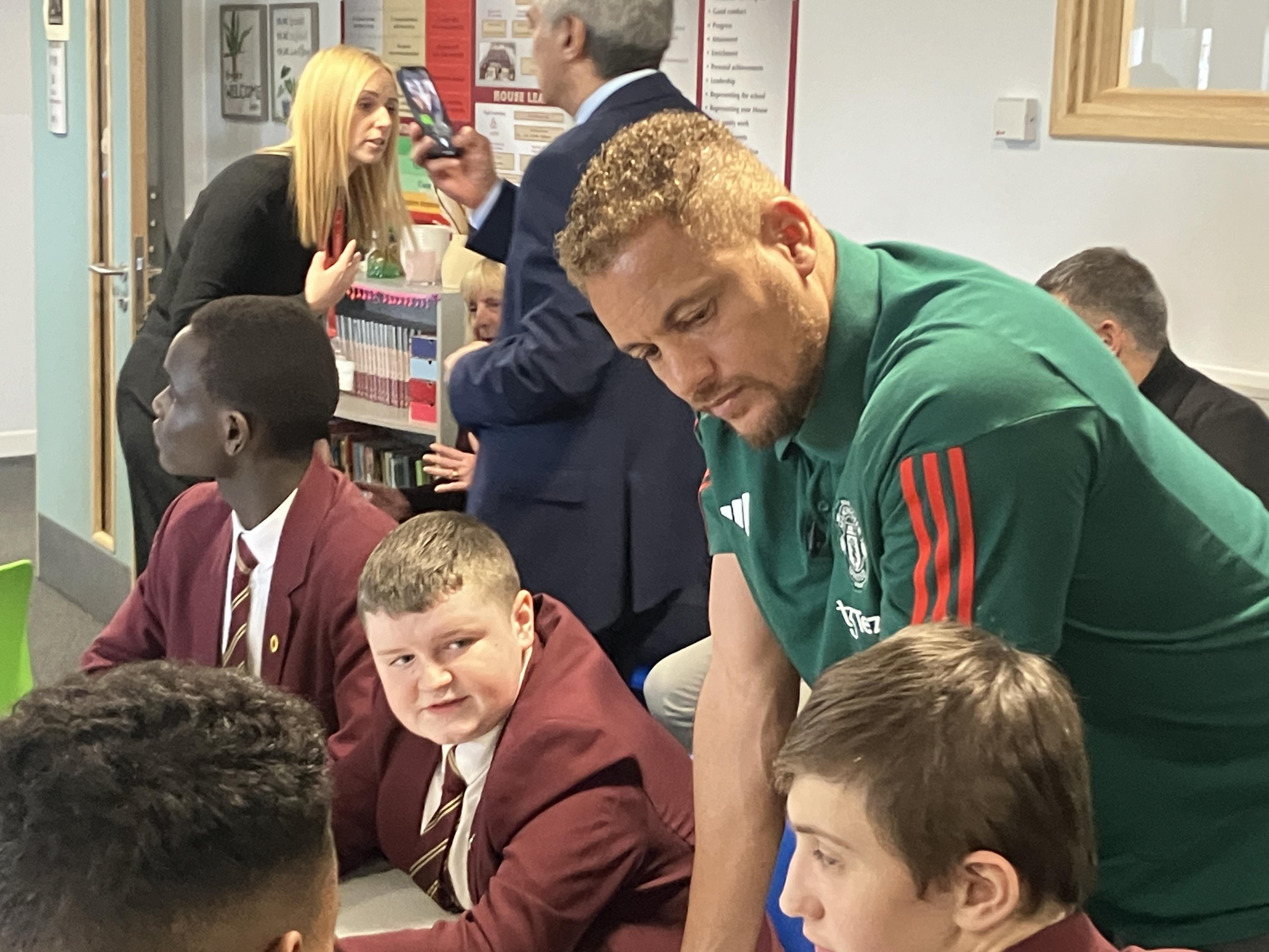 Former Man Utd player, Wes Brown with pupils at the tragedy chanting sessions