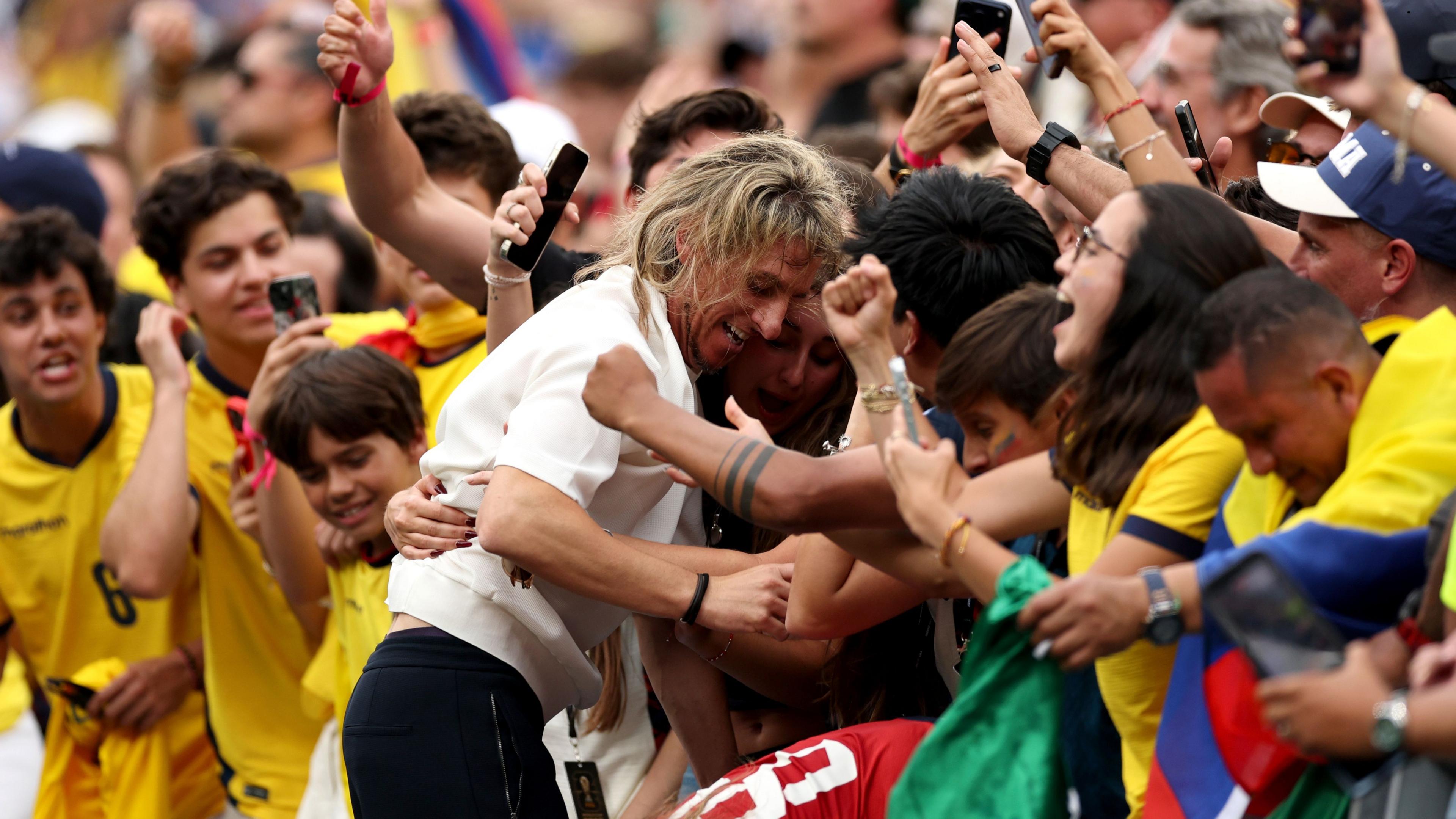 Sebastian Beccacece, Head Coach of Ecuador, celebrates with fans and family members after the 2-1 win against Germany