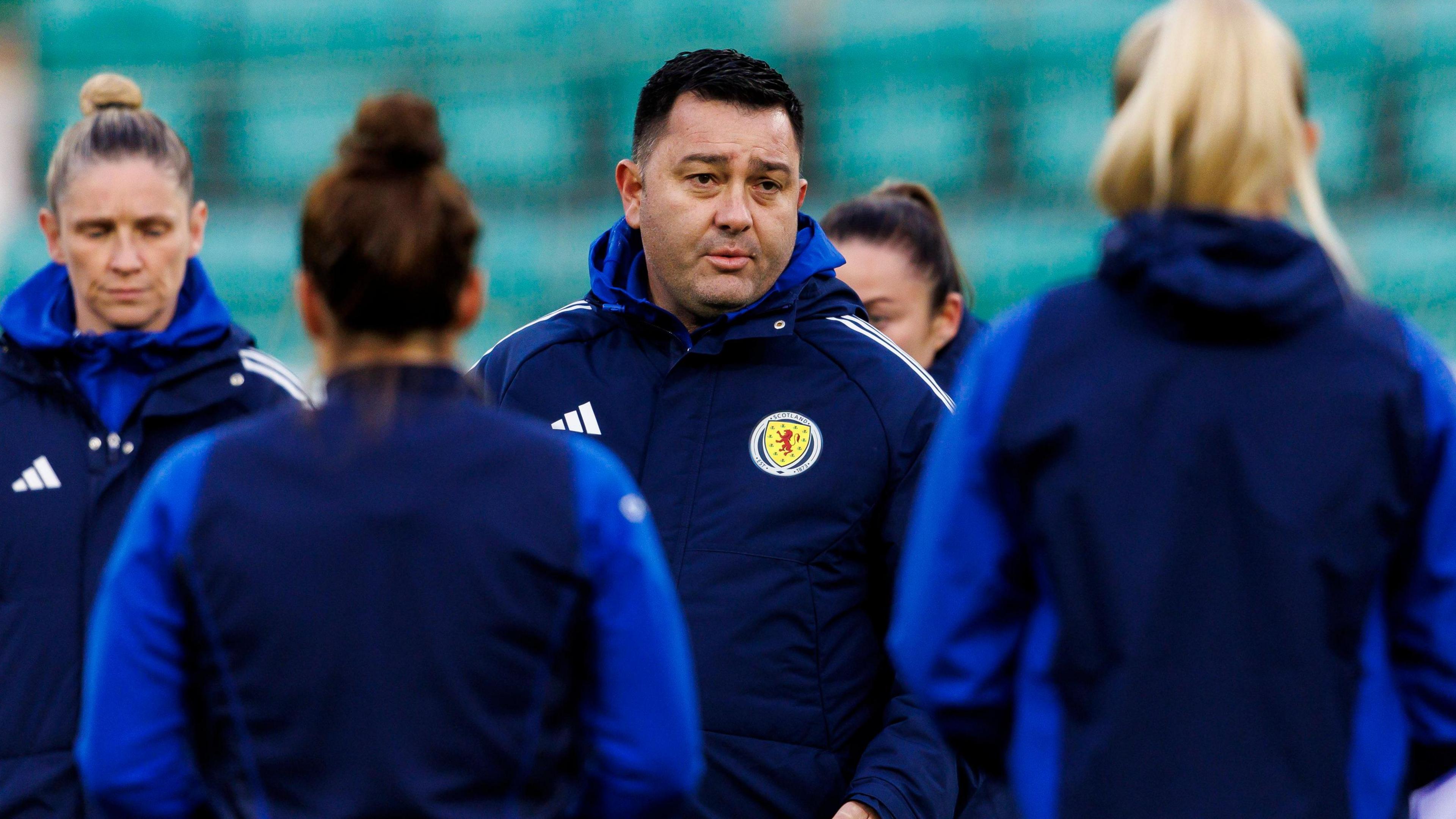 Scotland head coach Pedro Martinez Losa talks to his players