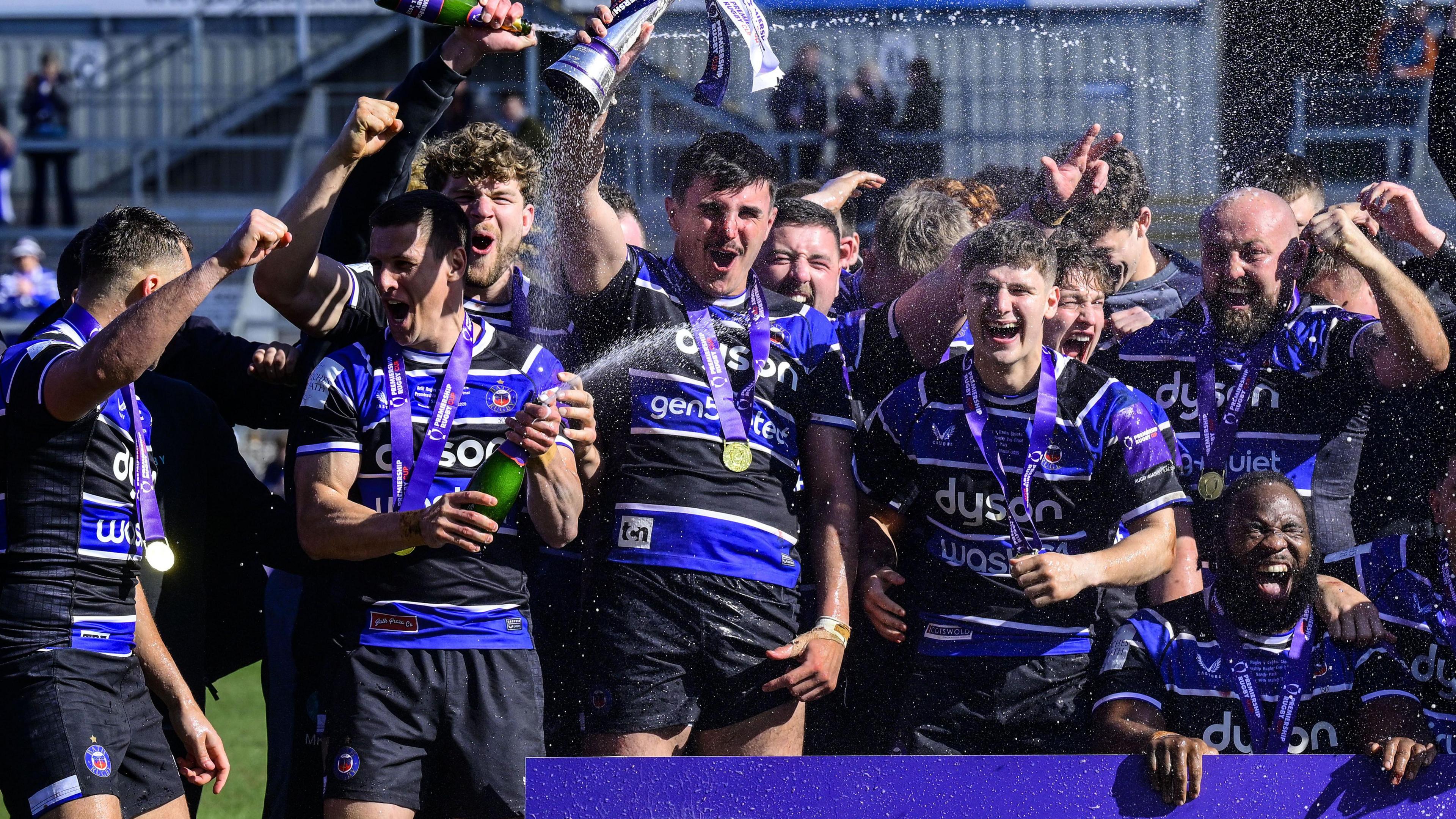 Bath players celebrate winning the Premiership Rugby Cup