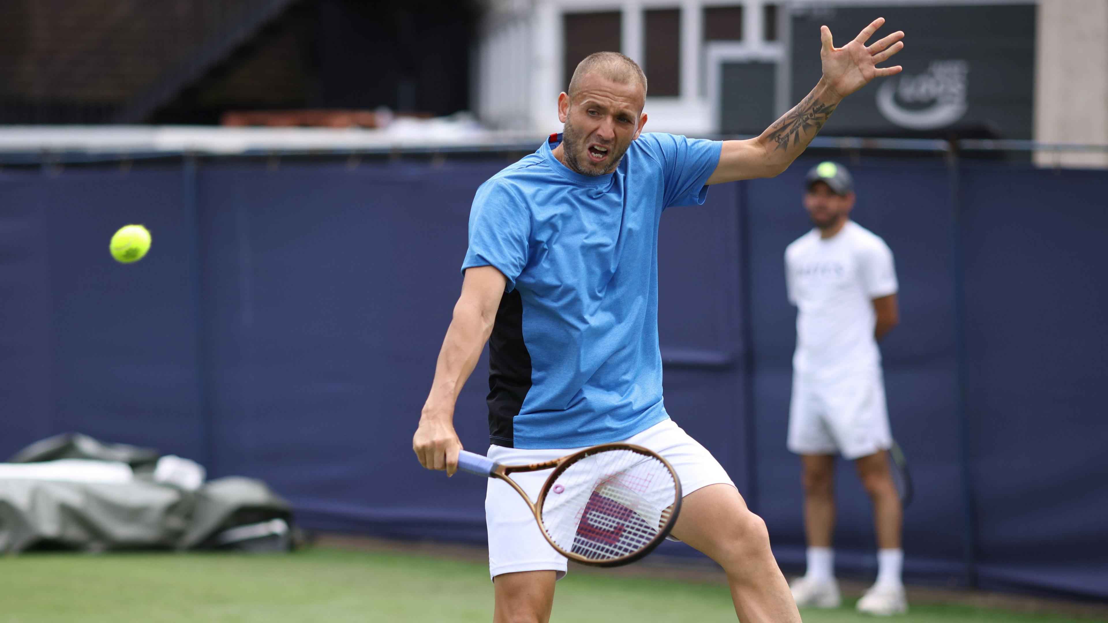 Dan Evans plays a backhand