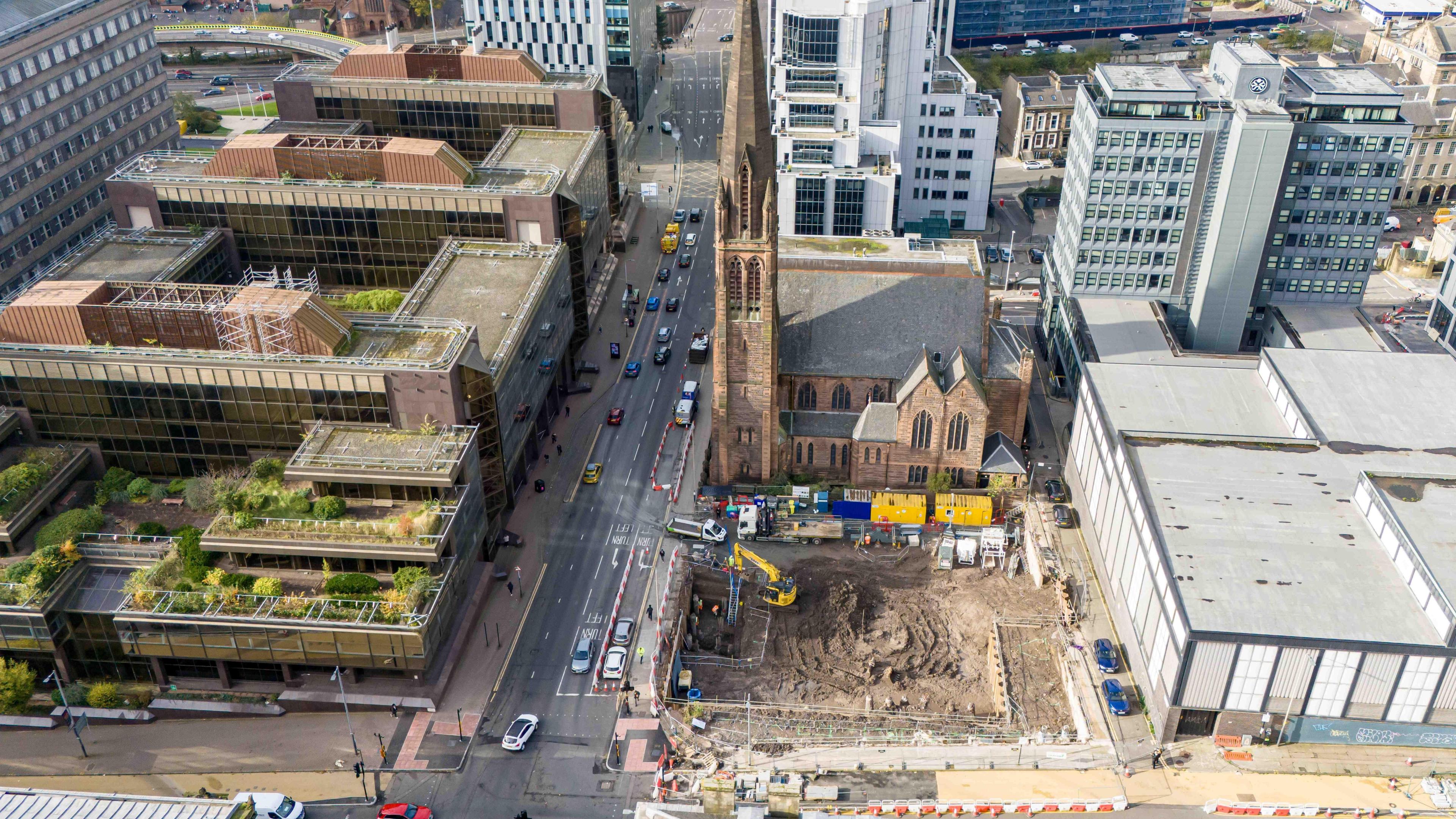 The empty site with construction work beginning at the corner of St Vincent Street. It is next to St Columba Church of Scotland. 