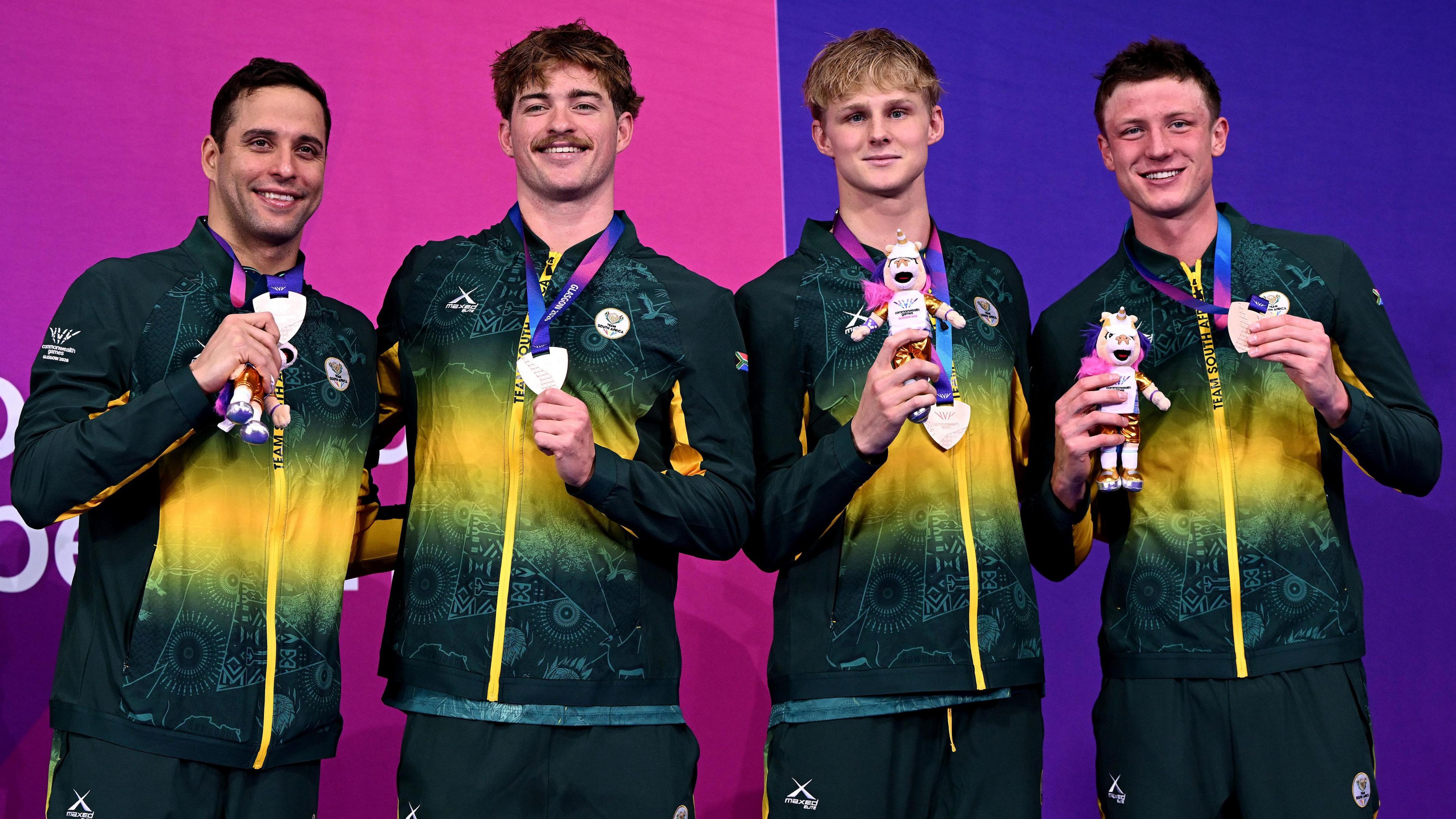 Bronze medalists Pieter Coetze, Guy Brooks, Ruard van Renen and Chad le Clos of Team South Africa pose for a photo during the medal ceremony for the Men's 4 x 100m Freestyle Relay Final on day one of the Glasgow 2026 Commonwealth Games at Tollcross International Swimming Centre.