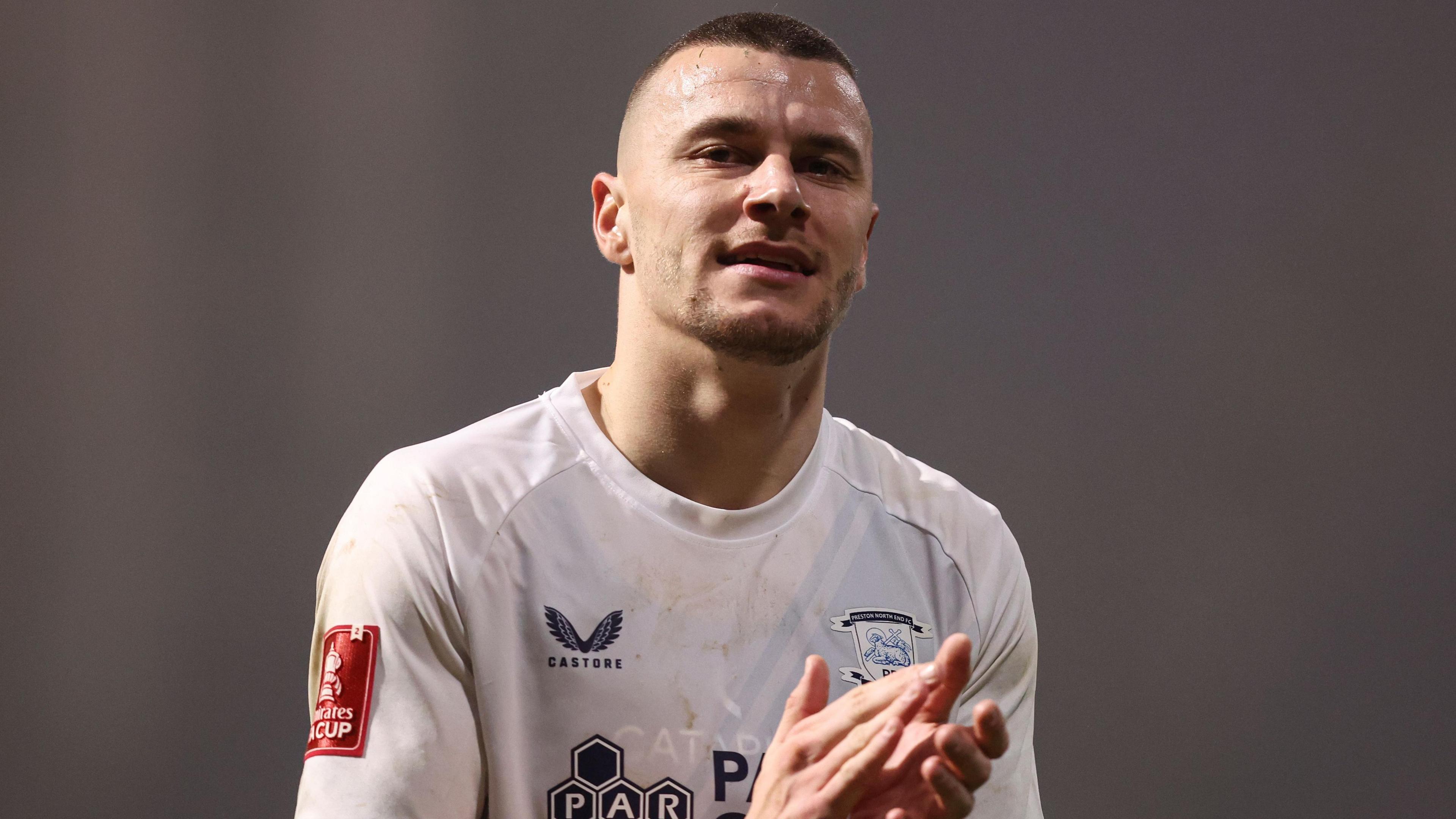 Preston North End striker Milutin Osmajic claps the home support