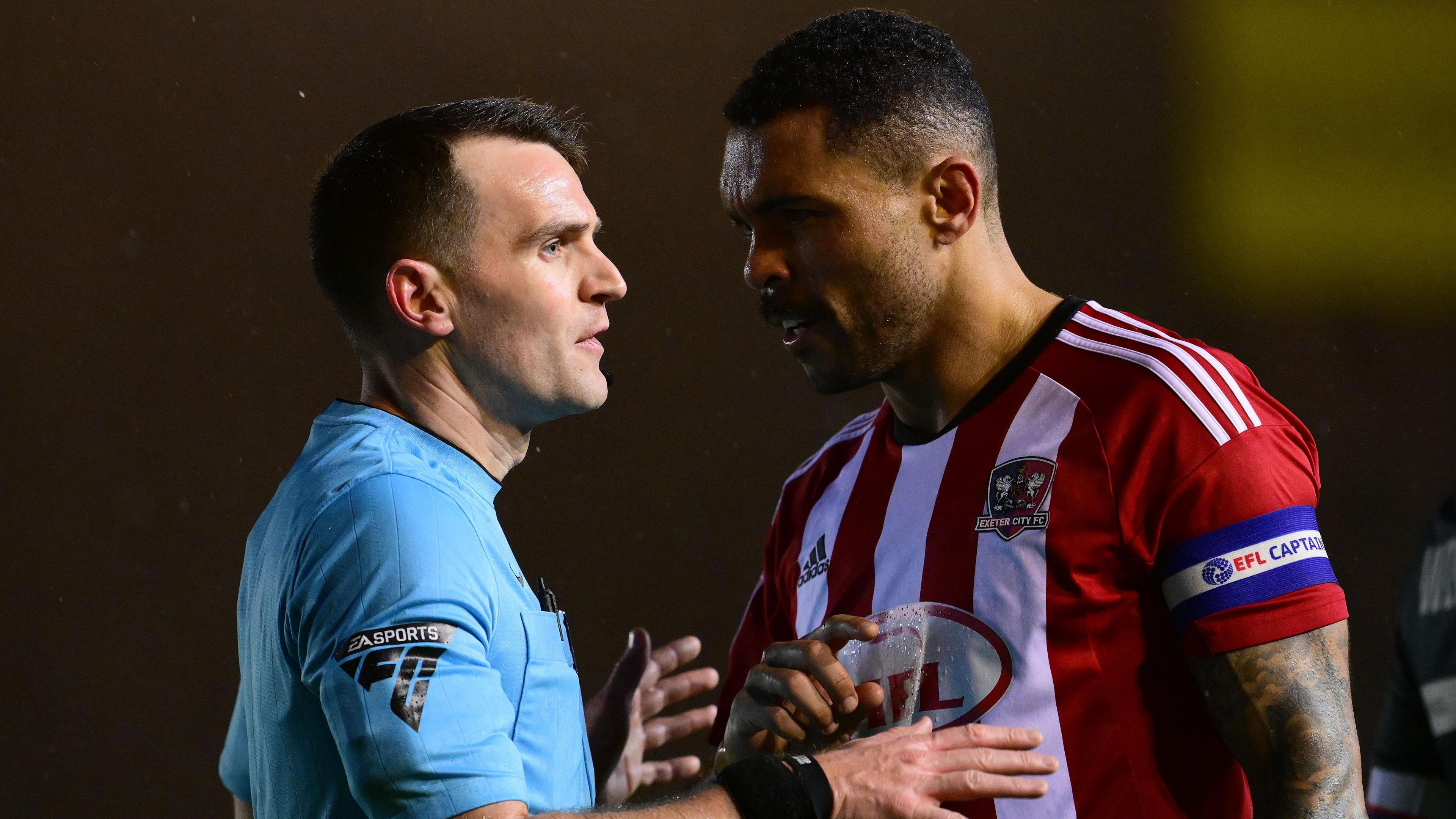 Josh Magennis reports the incident to referee Ben Speedie