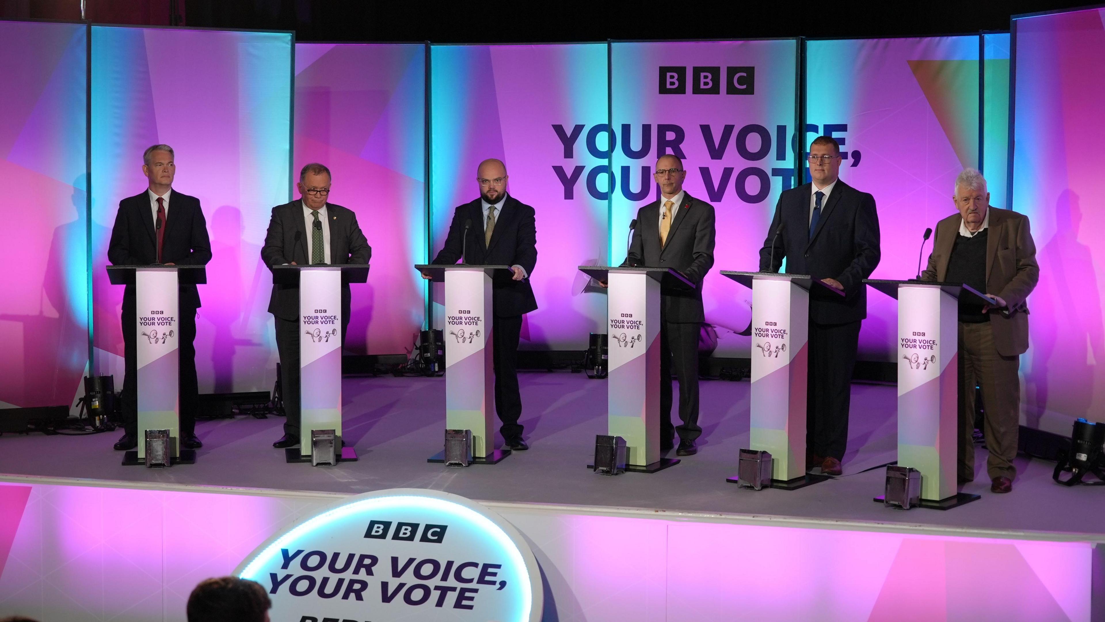 All of the debate candidates at their podiums
