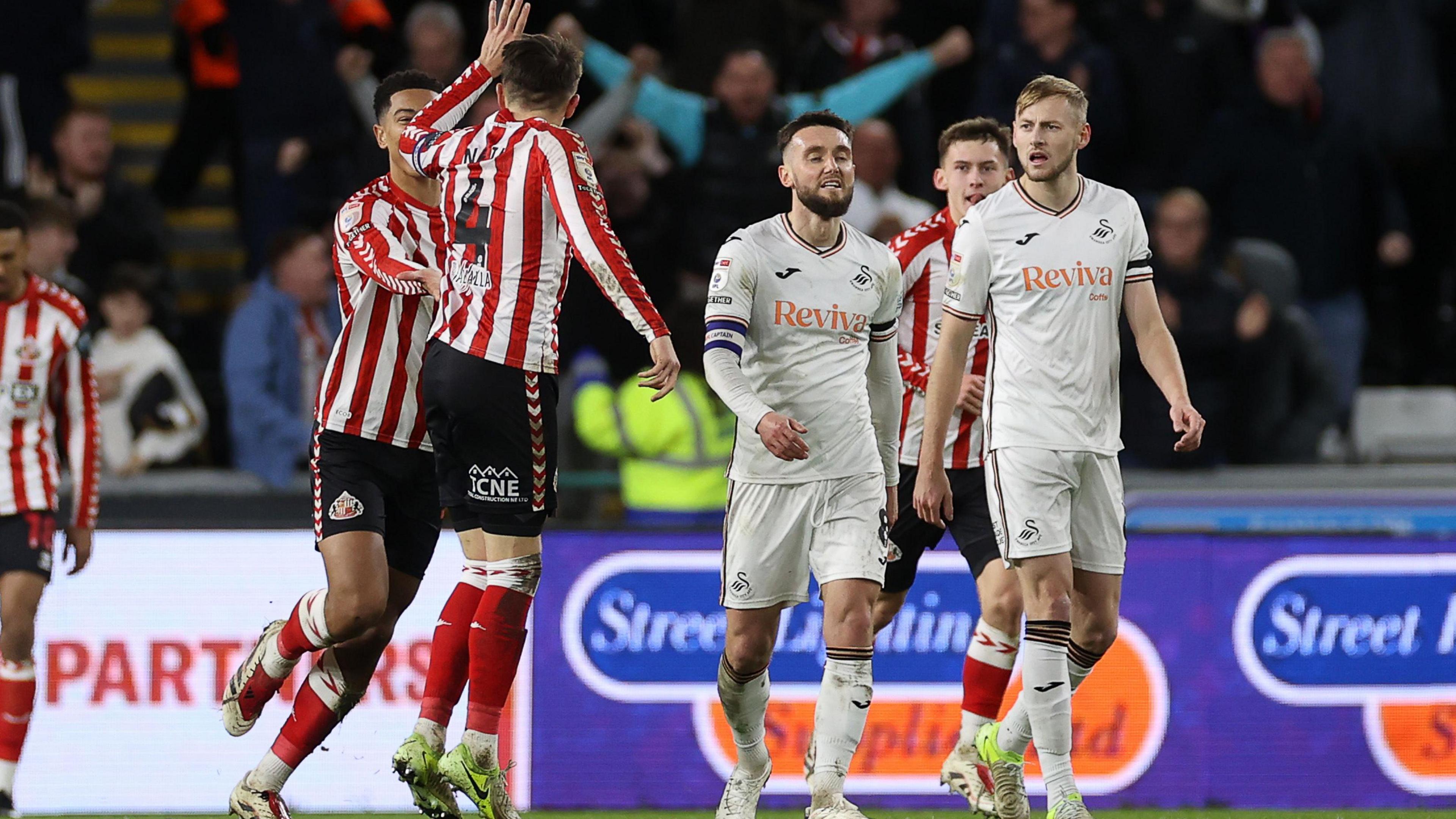 Sunderland celebrate Dan Neil's equaliser at Swansea 