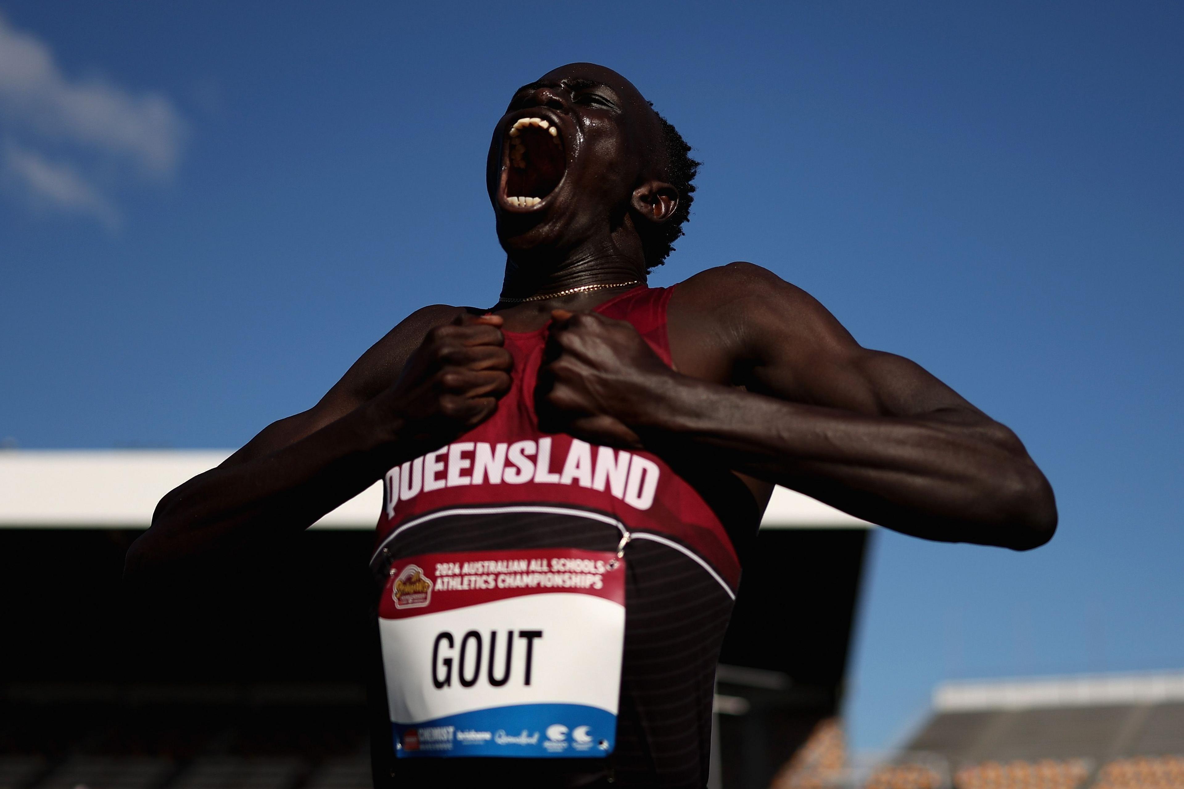 Record breaking 16-year-old Gout Gout celebrates winning the boys' U18 100m final at the 2024 Australian All Schools Athletics Championships in Brisbane