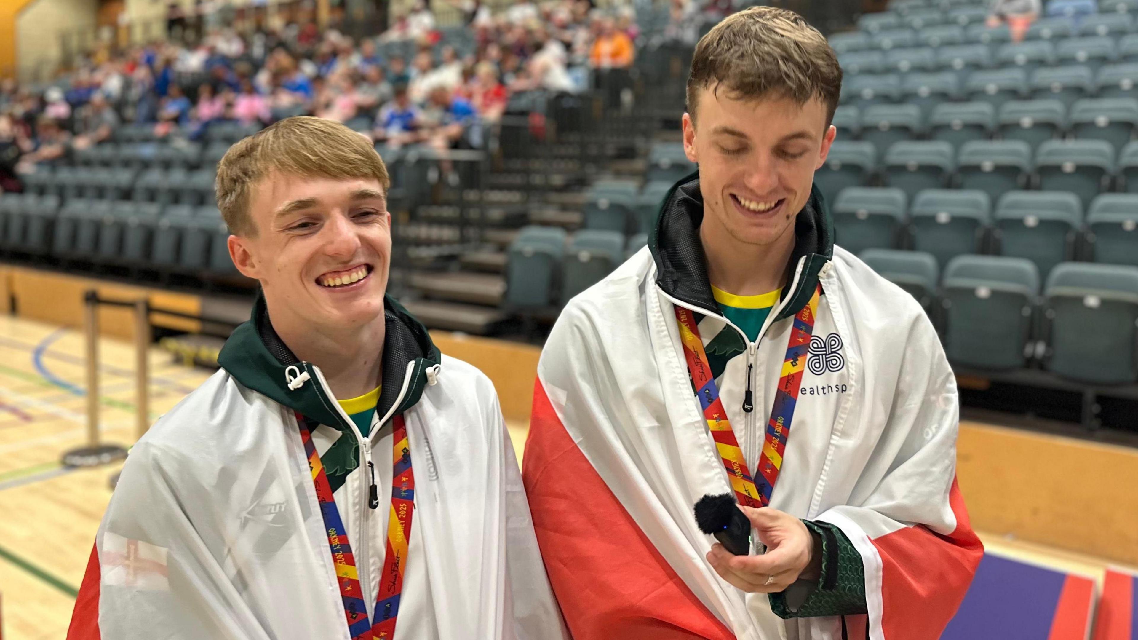 Alex Tapp and David Trebert pose with their medals
