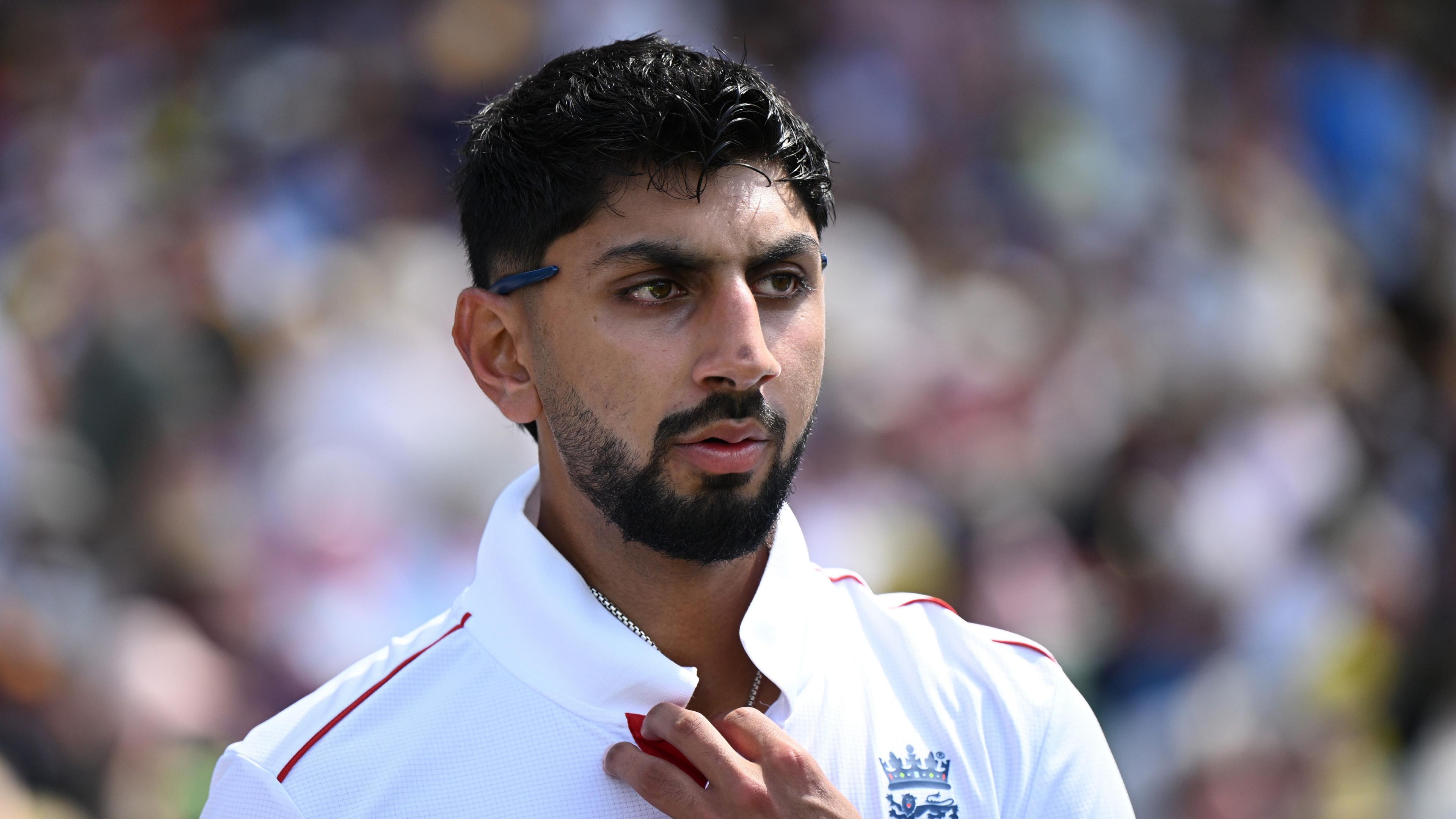 Shoaib Bashir looks on