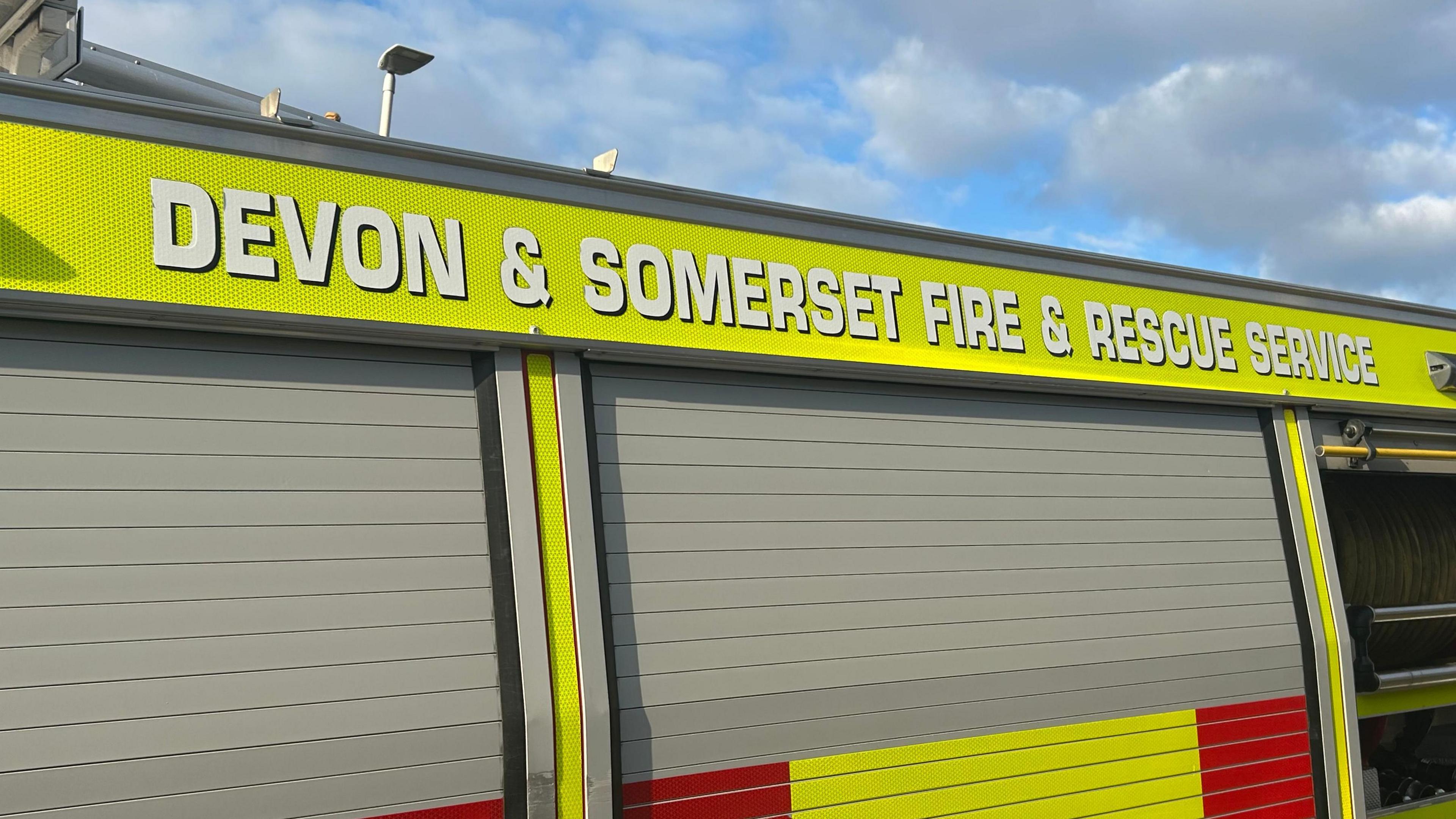 A close up of a fire engine which says Devon and Summerset Fire and Rescue Service