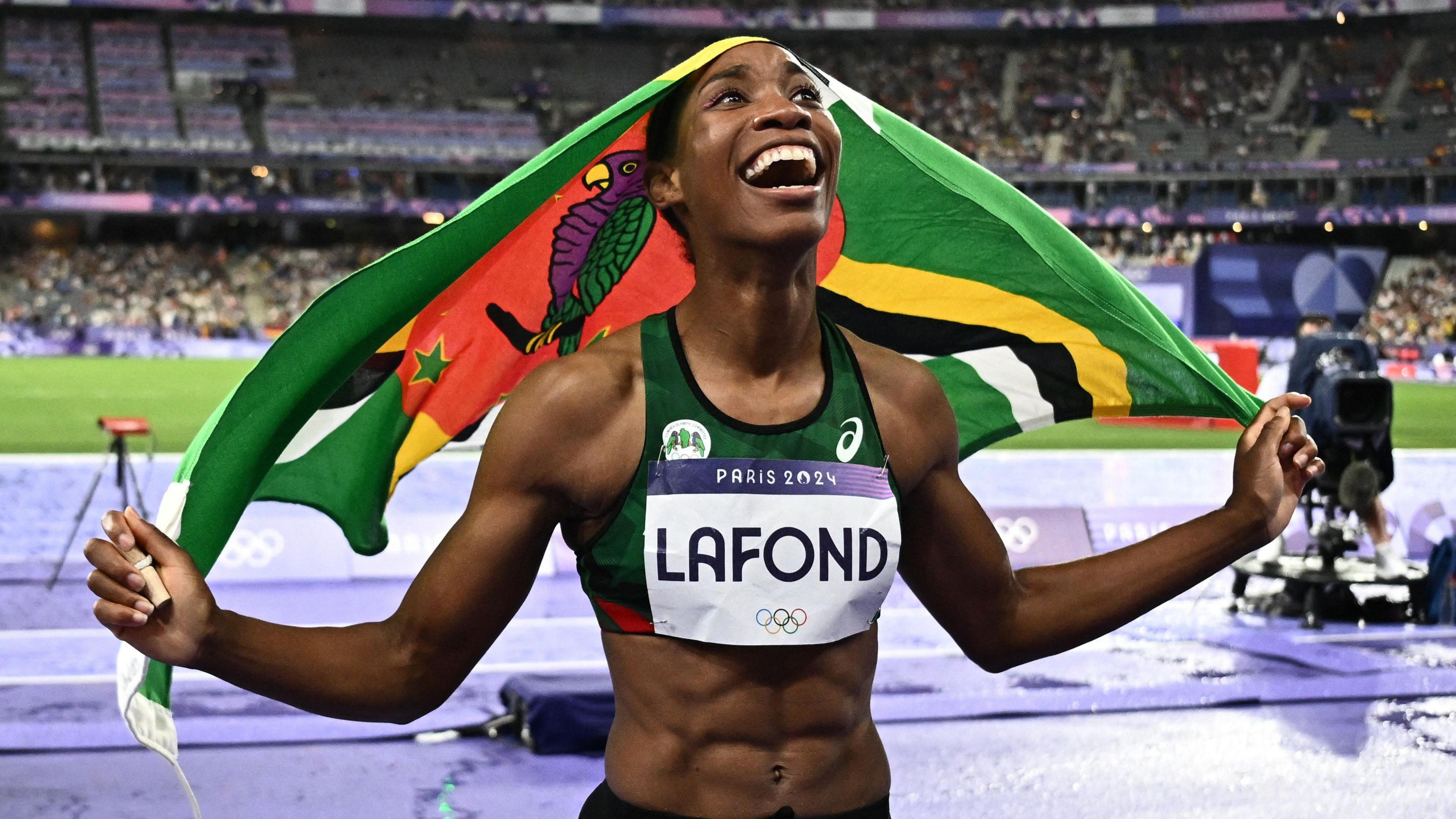 Thea Lafond of Dominica celebrates after winning gold