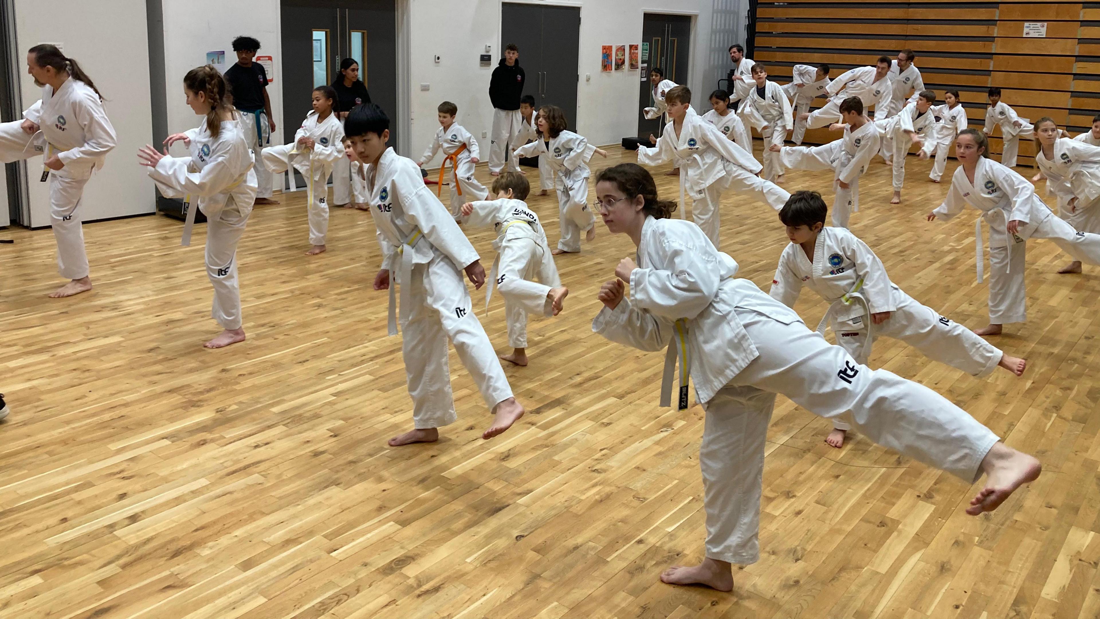 Picture of Cambridge Taekwon-Do members, young and old, since becoming established in 2015