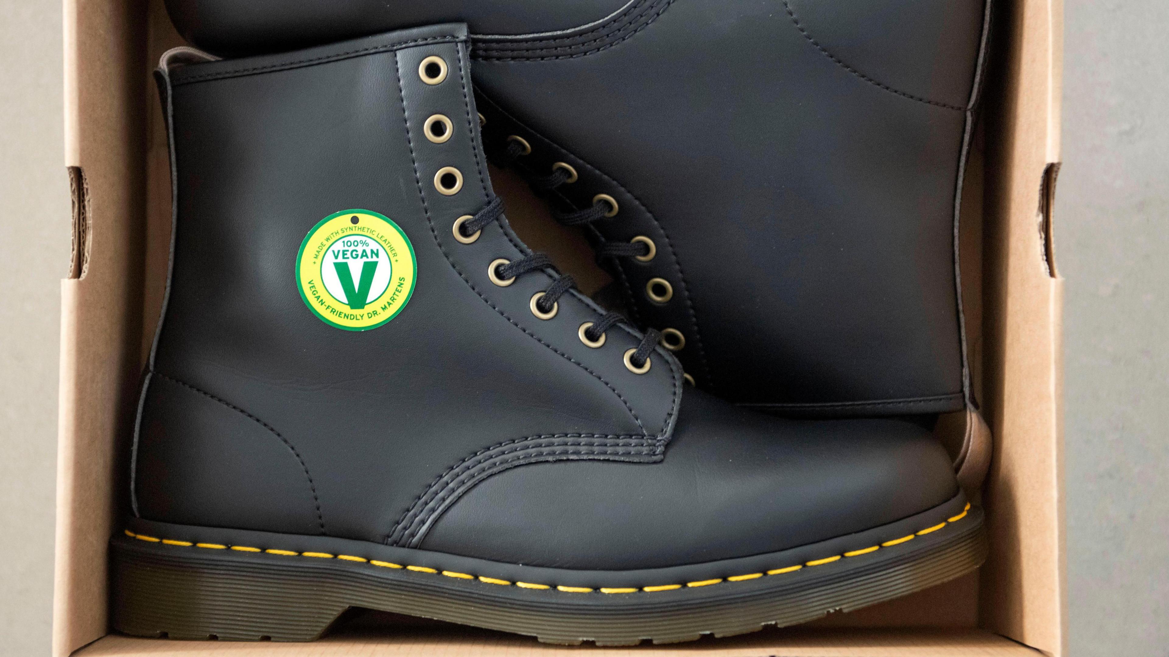 Black pair of Dr Marten's vegan boots in a shoebox