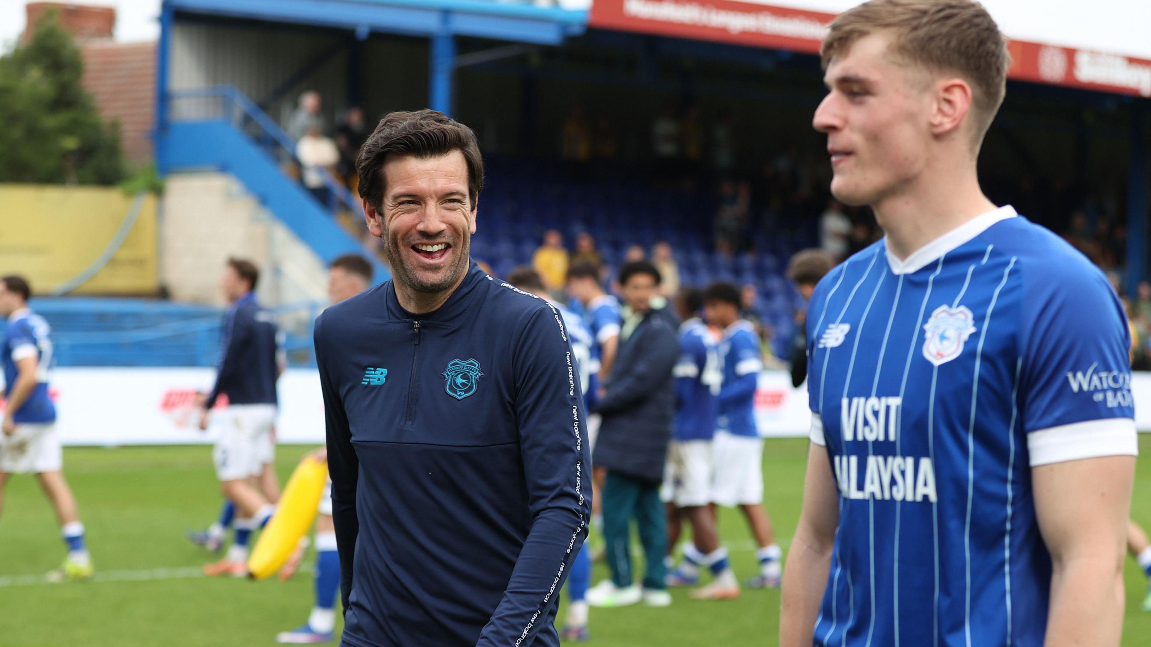 Head coach Brian Barry-Murphy (left) of Cardiff with Dylan Lawlor of Cardiff at the end of the match against Mansfield in May